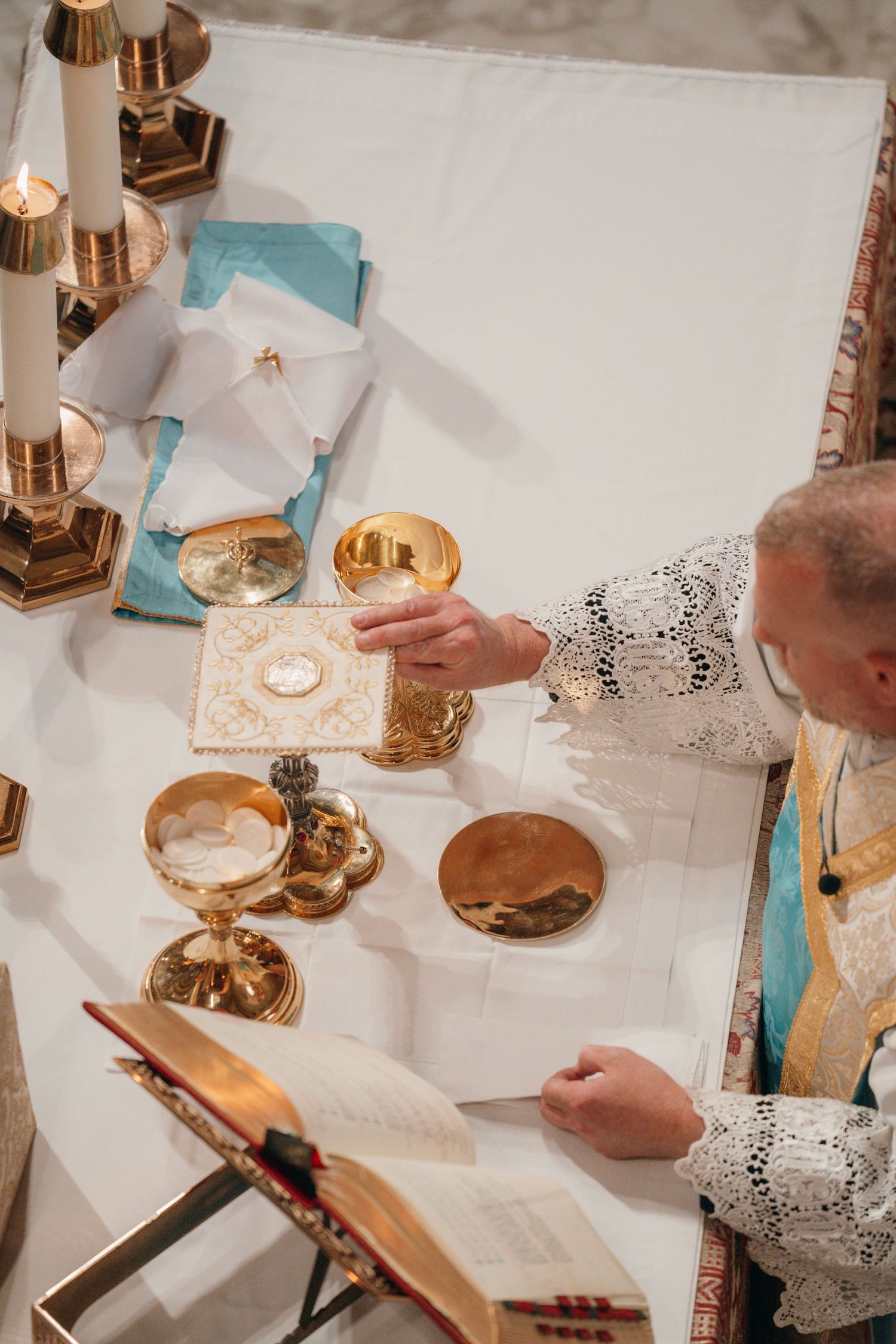 Priest preparing the chalice and paten at the altar during a Nuptial Mass
