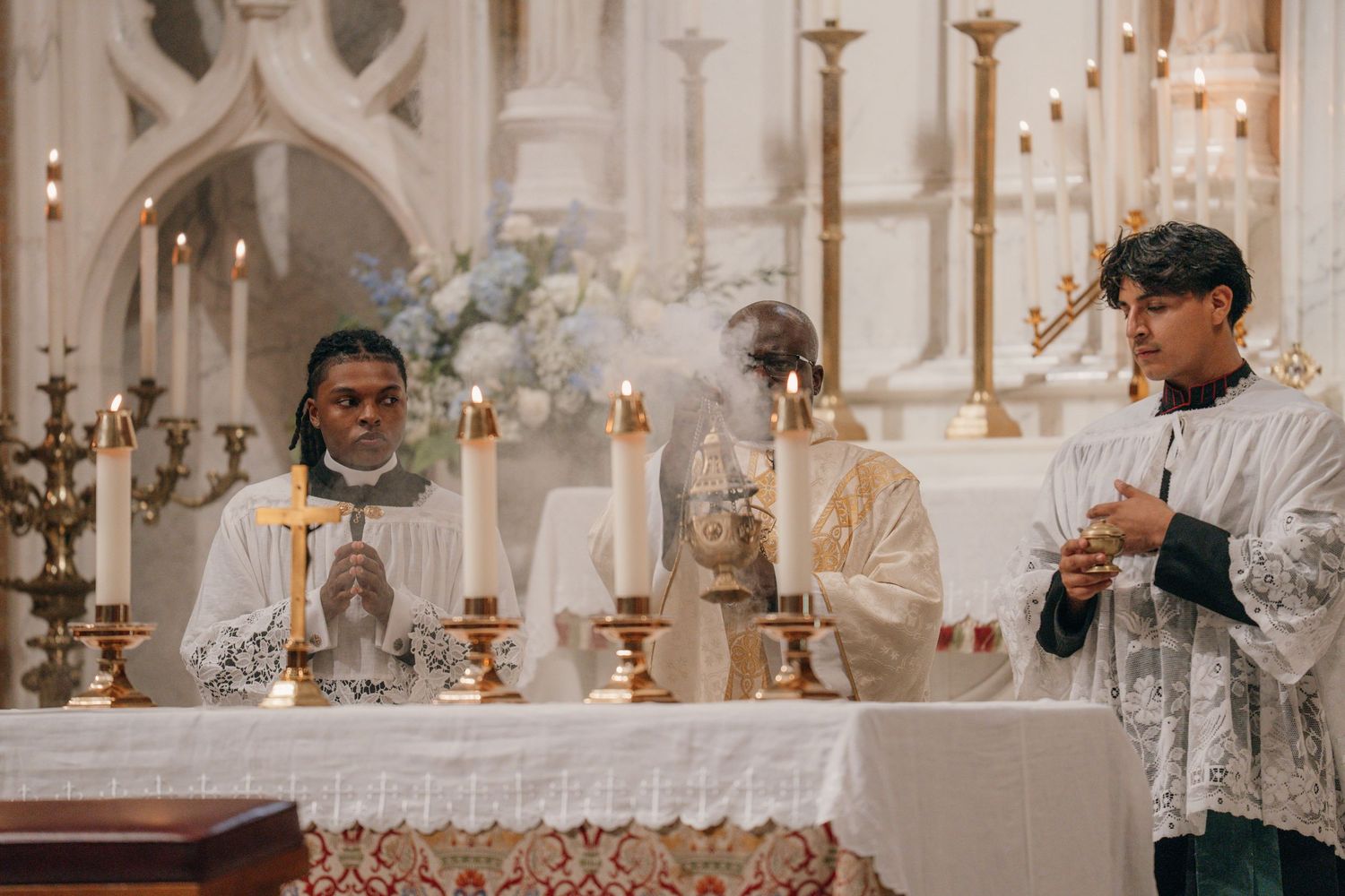 Priest and altar servers at the altar during the Liturgy of the Eucharist