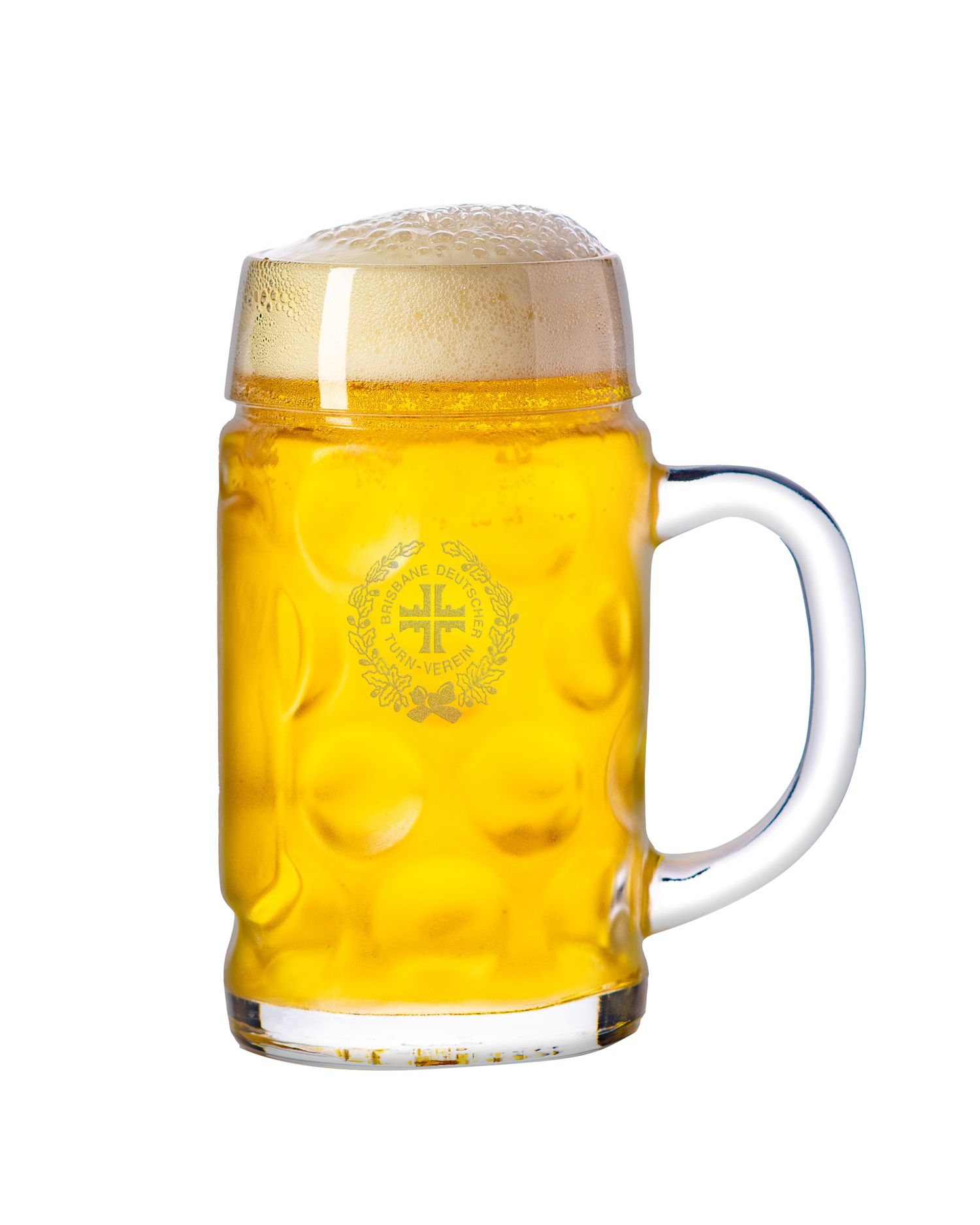 Large dimpled German beer stein mug filled with golden lager and thick foamy head, engraved crest.