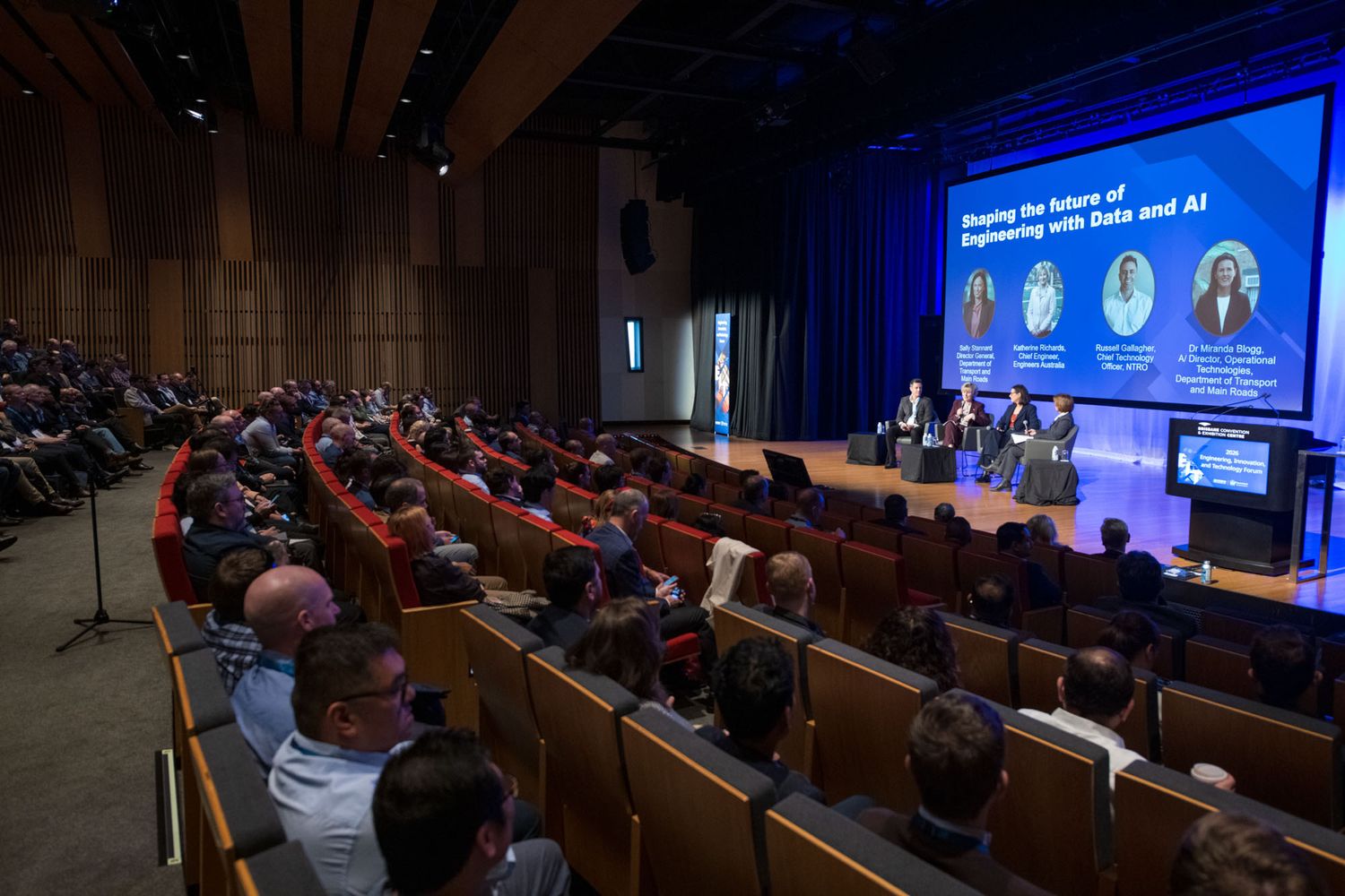 Panel discussion on shaping engineering future with Data and AI in full auditorium.