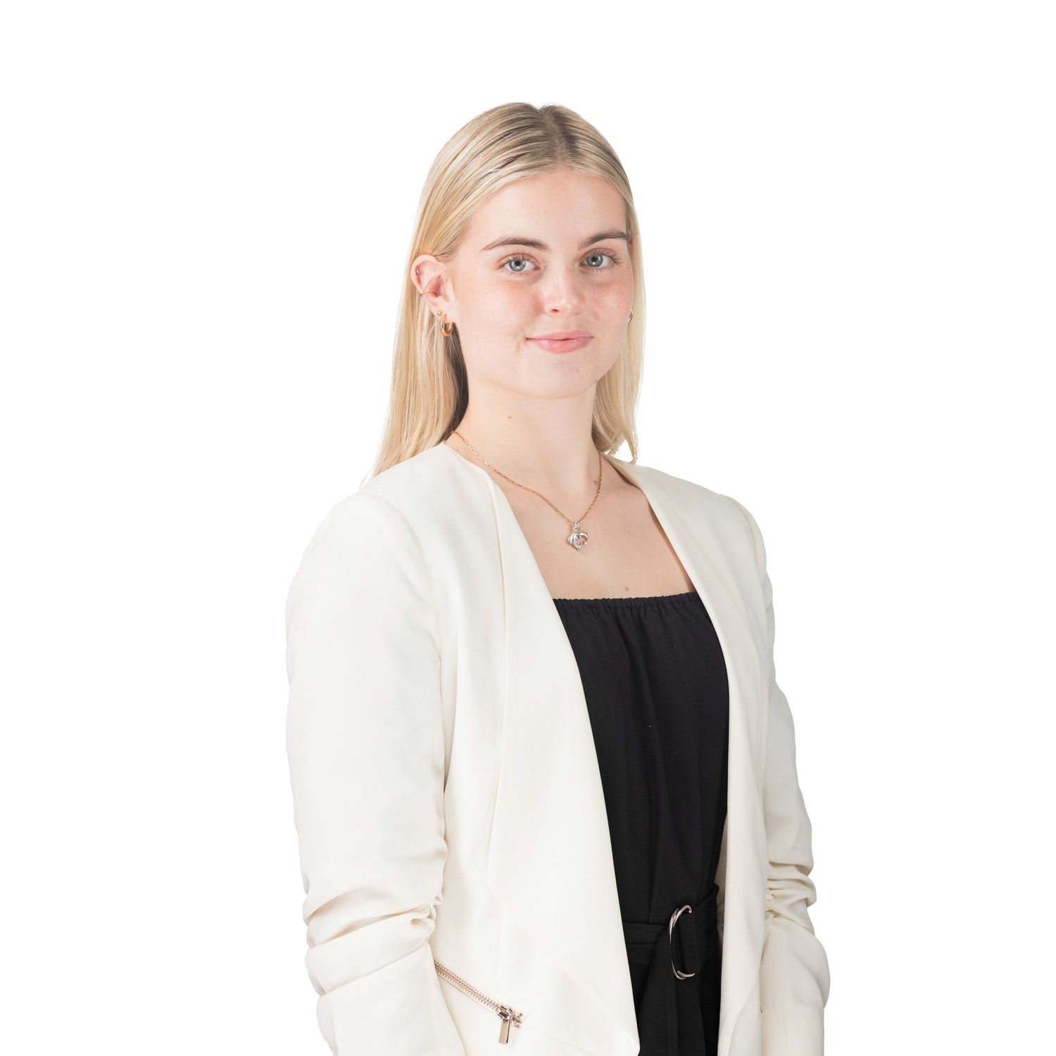 Young blonde woman in white blazer and black top, professional corporate headshot on white background.