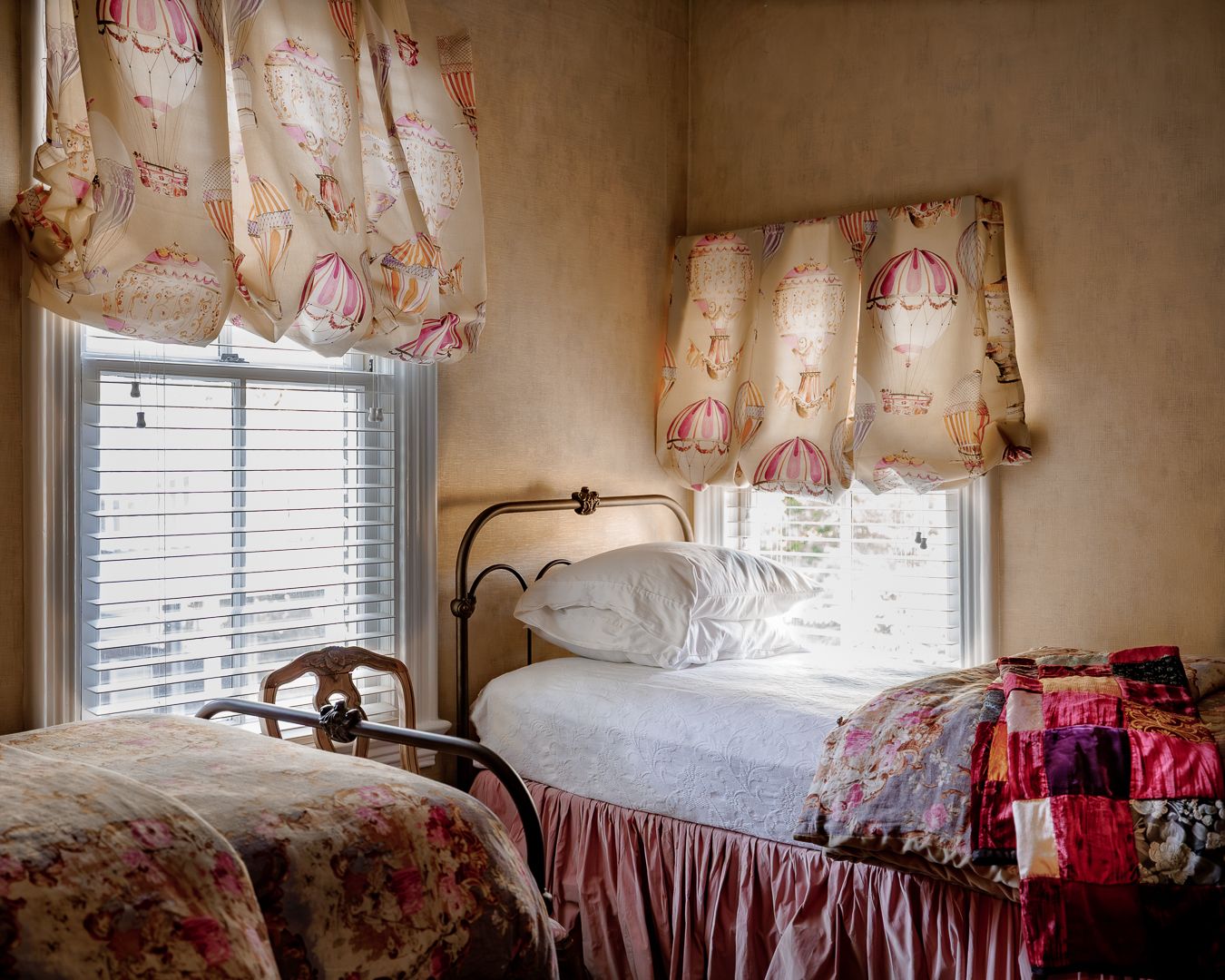 Vintage guest bedroom with two beds and floral decor