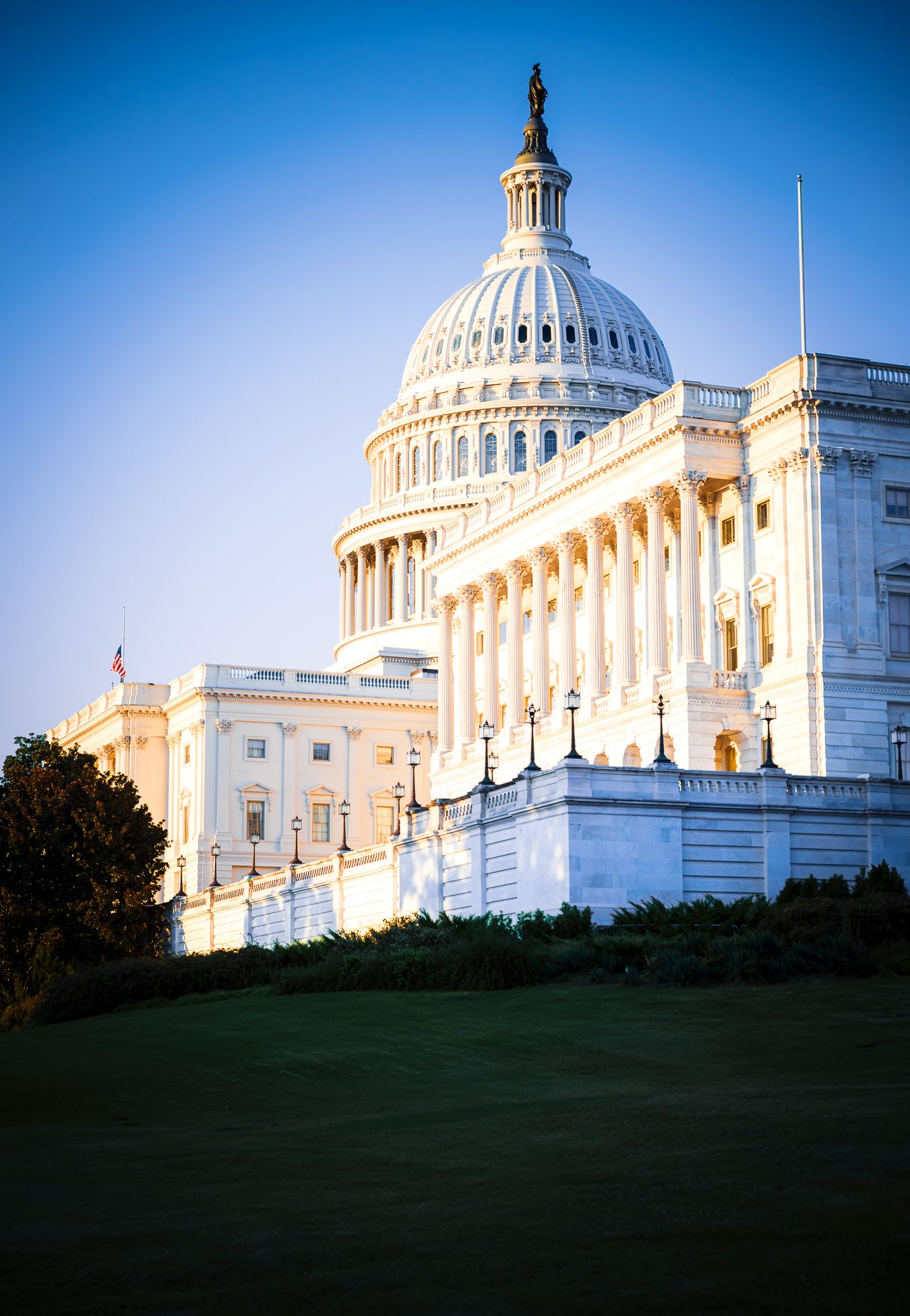 U.S. Capitol illuminated by warm golden-hour sunlight