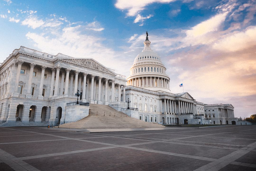 U.S. Capitol building beneath a colorful evening sky in Washington, D.C.