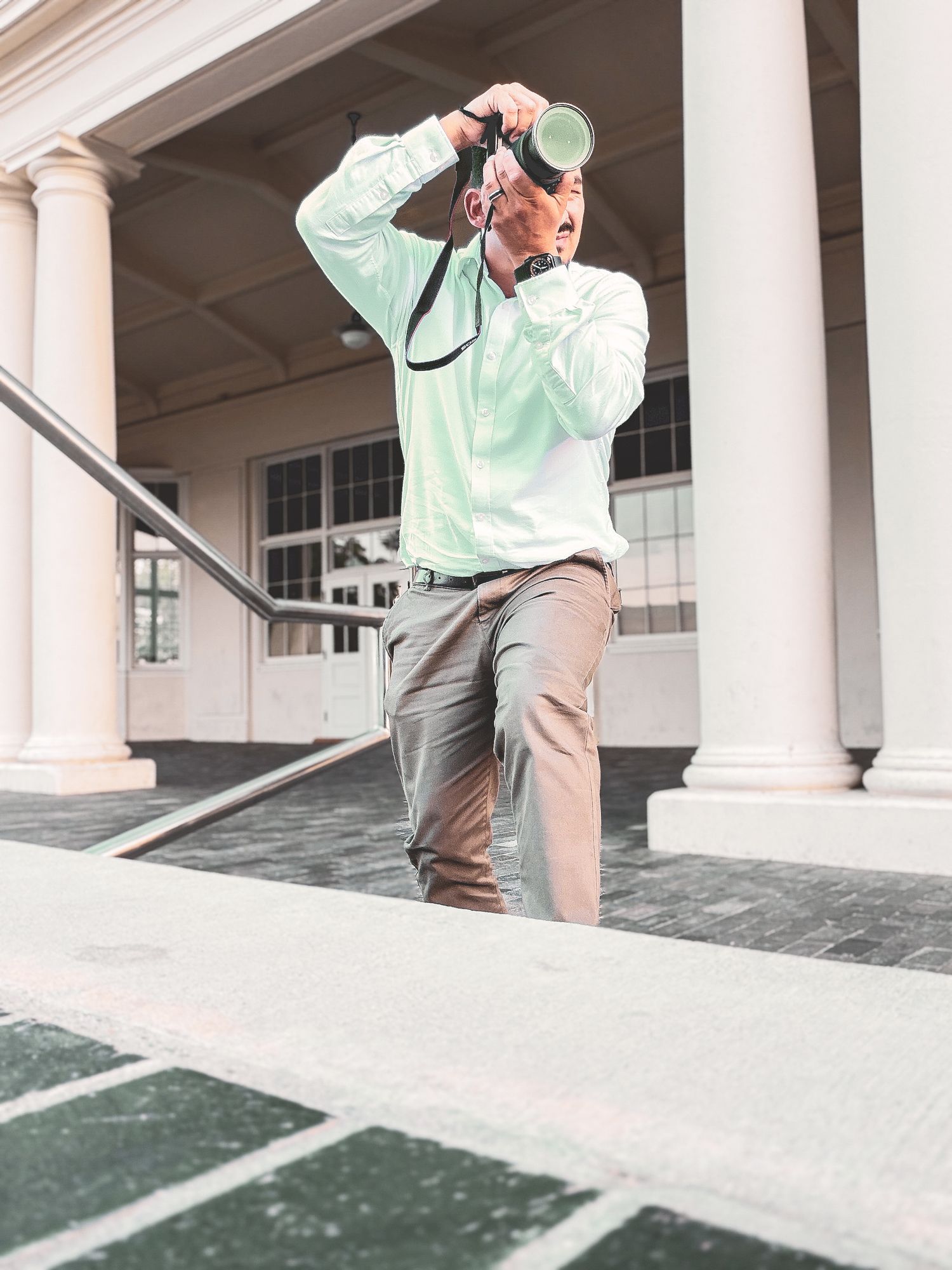 Portrait of photographer at a train station
