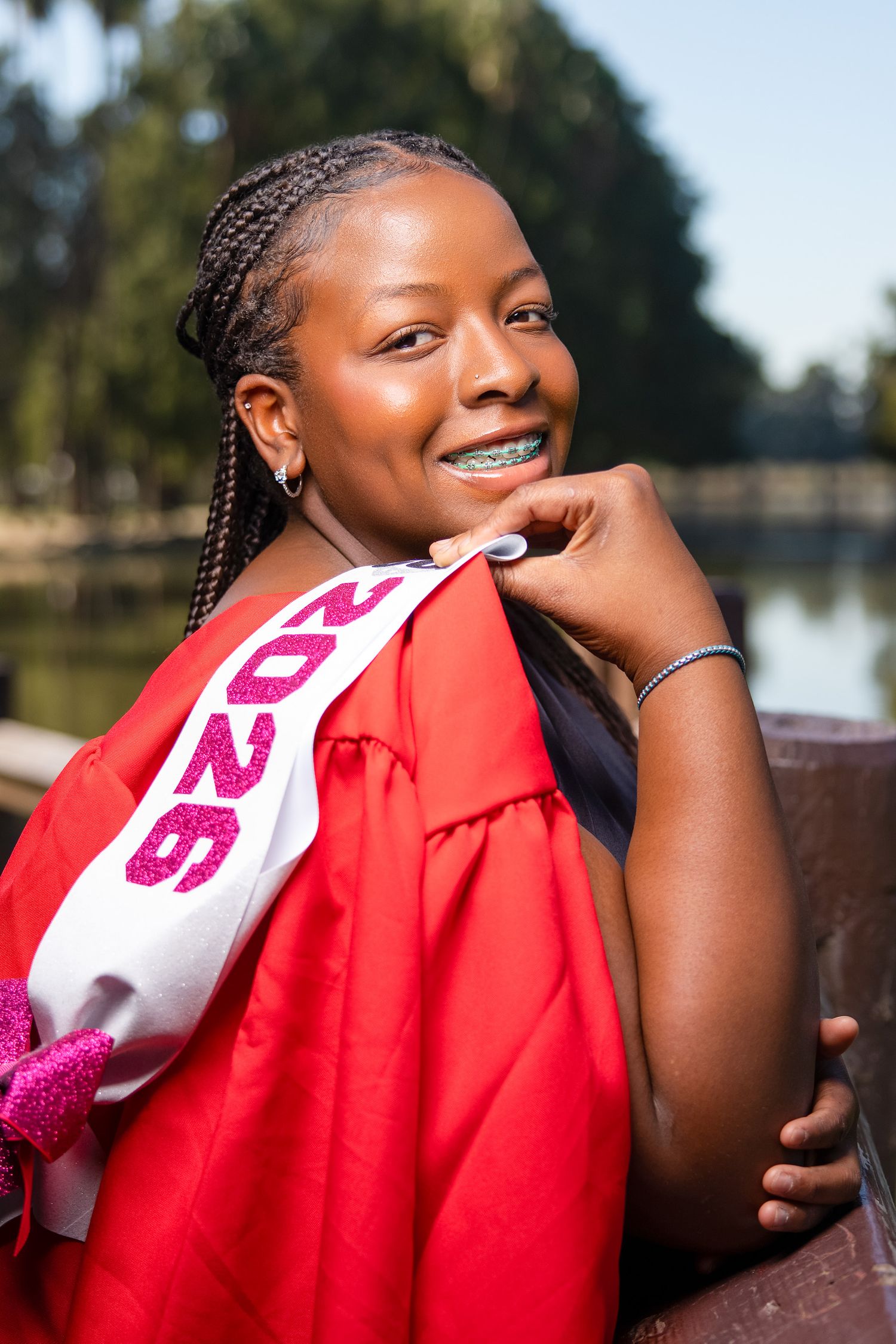 A sequence of candid outdoor portraits showing joyful expressions and laughter while wearing a red top.