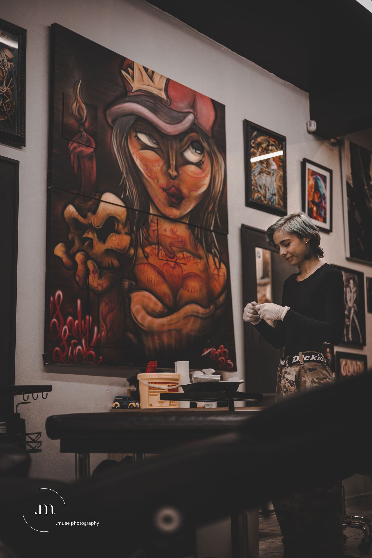 Artist standing inside a modern tattoo studio