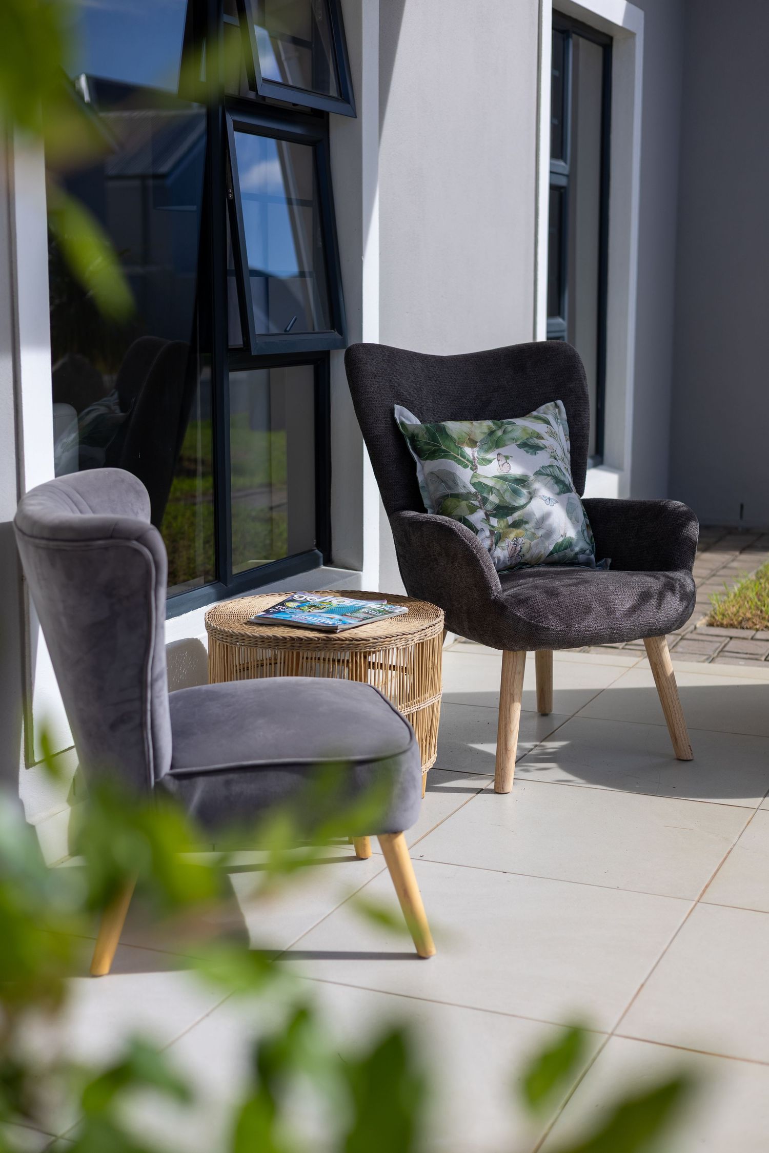 Two grey chairs in afternoon sunlight