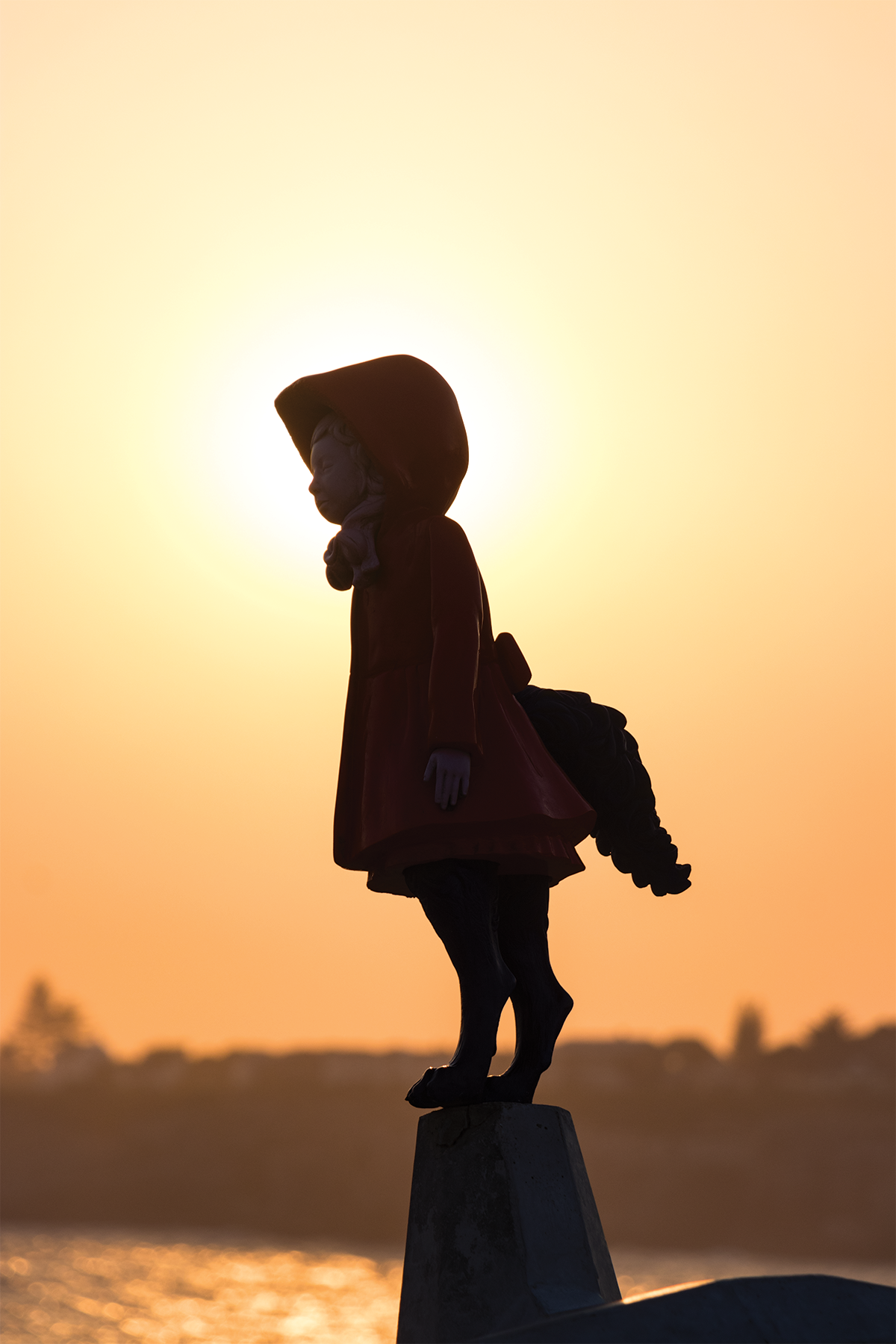 Silhouette portrait of a child during sunset golden hour