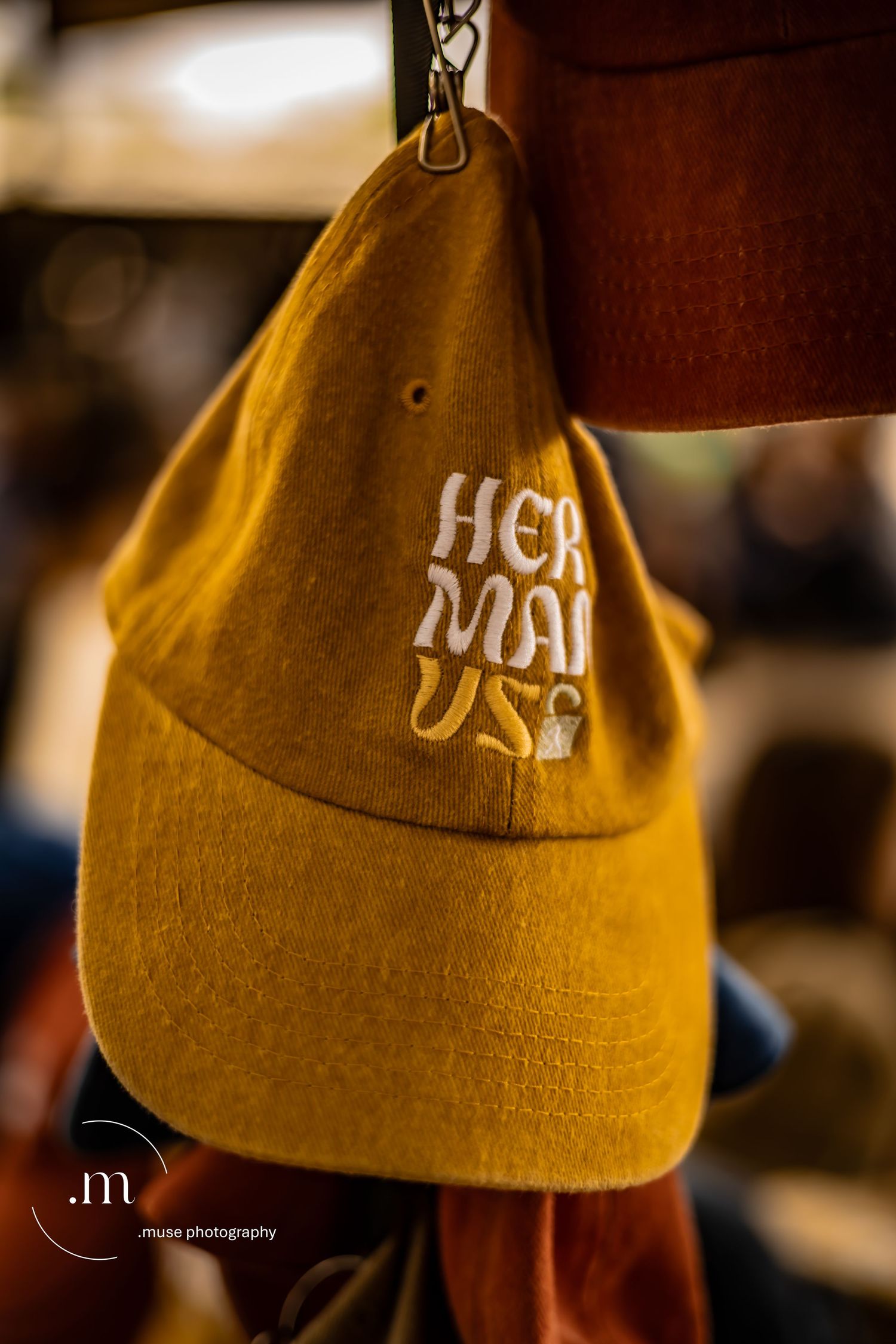 Yellow cap hanging indoors with warm cinematic lighting