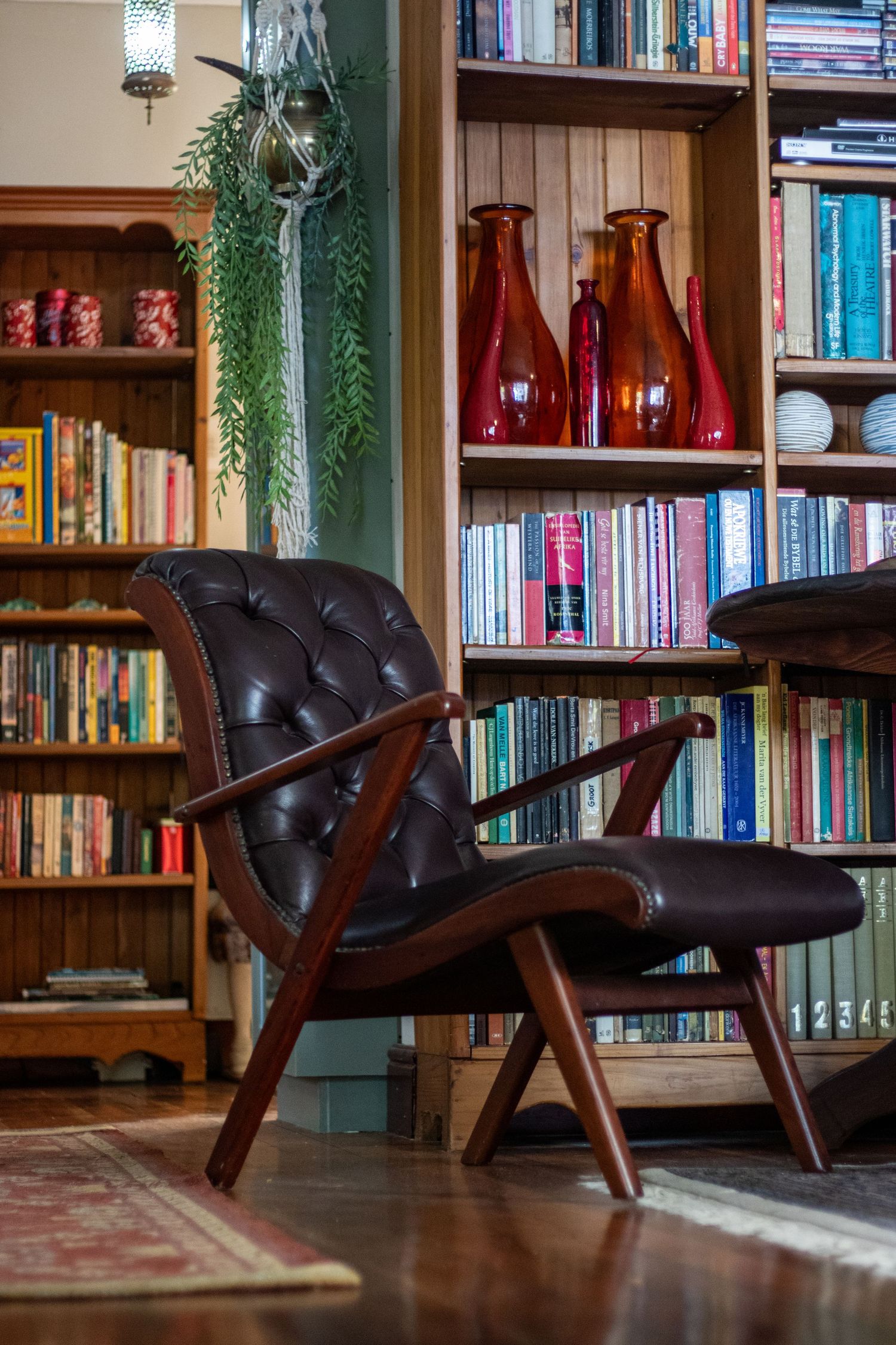 Vintage reading chair inside a cozy home library