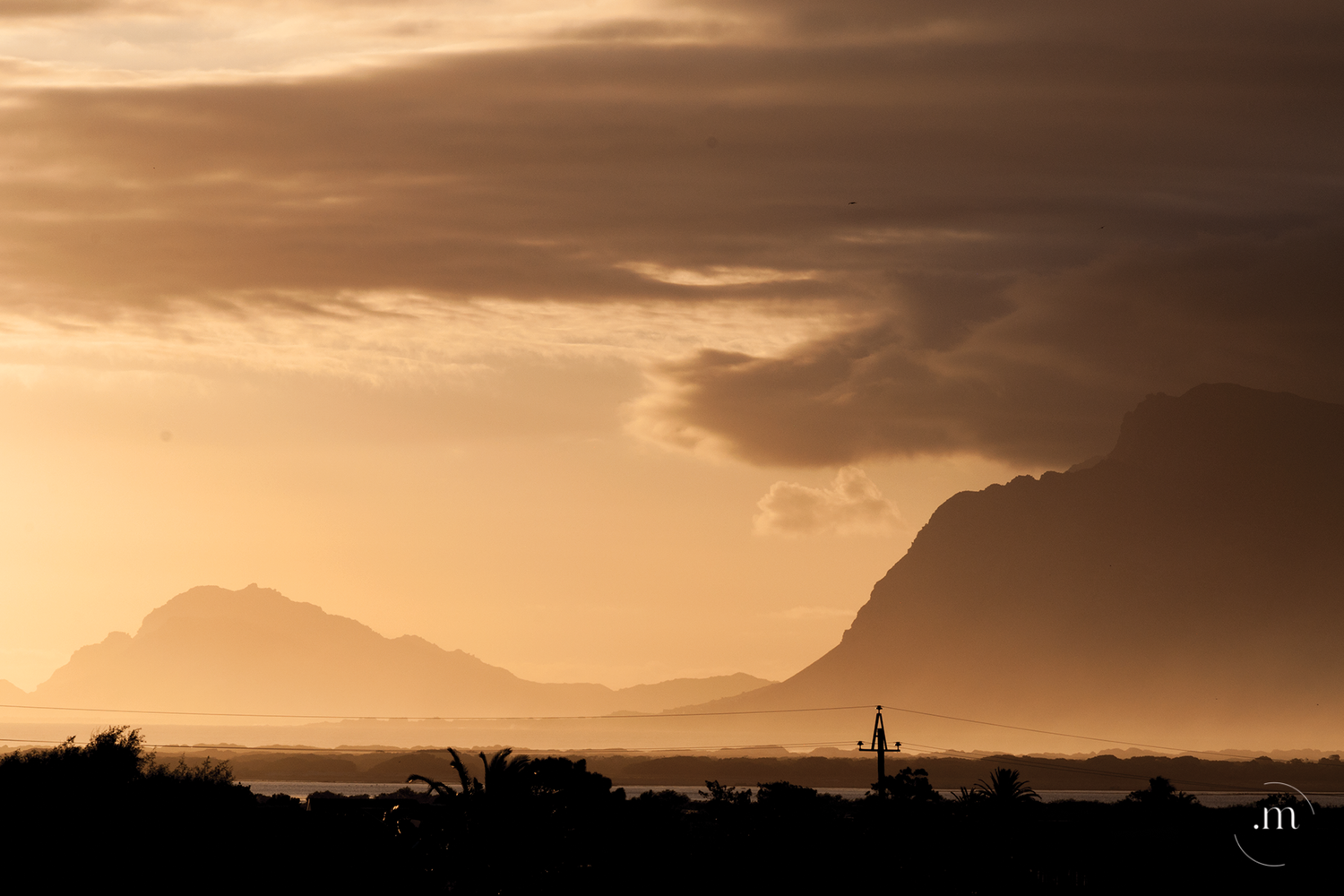 Mountain landscape during a dramatic golden sunset