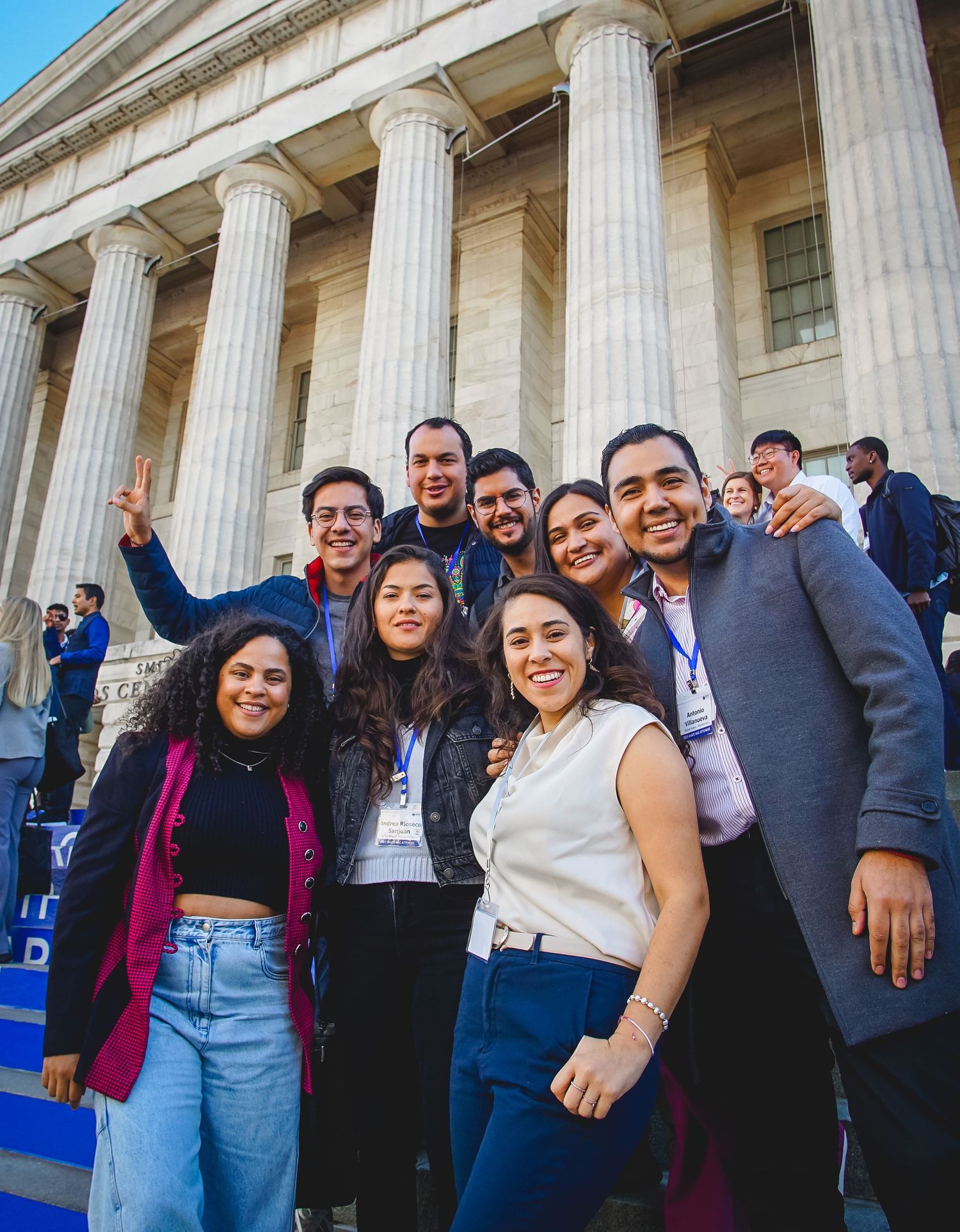 Group celebrates outside the Portrait Gallery building with white columns.