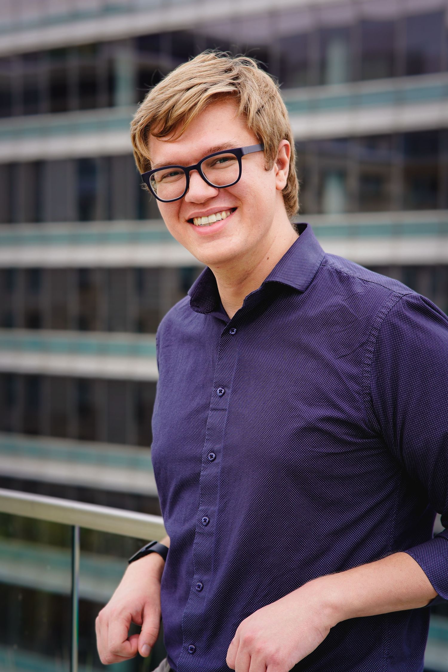 Series of casual business portraits showing confident poses against urban backdrop.