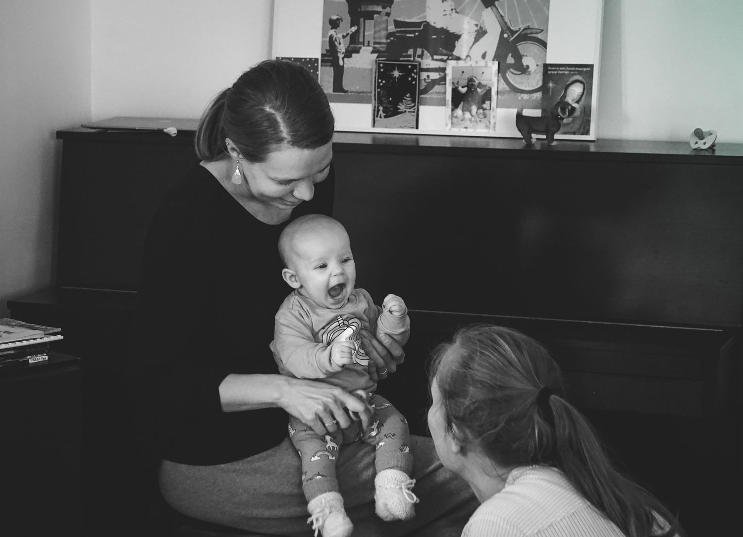 Black and white image of indoor family moment.
