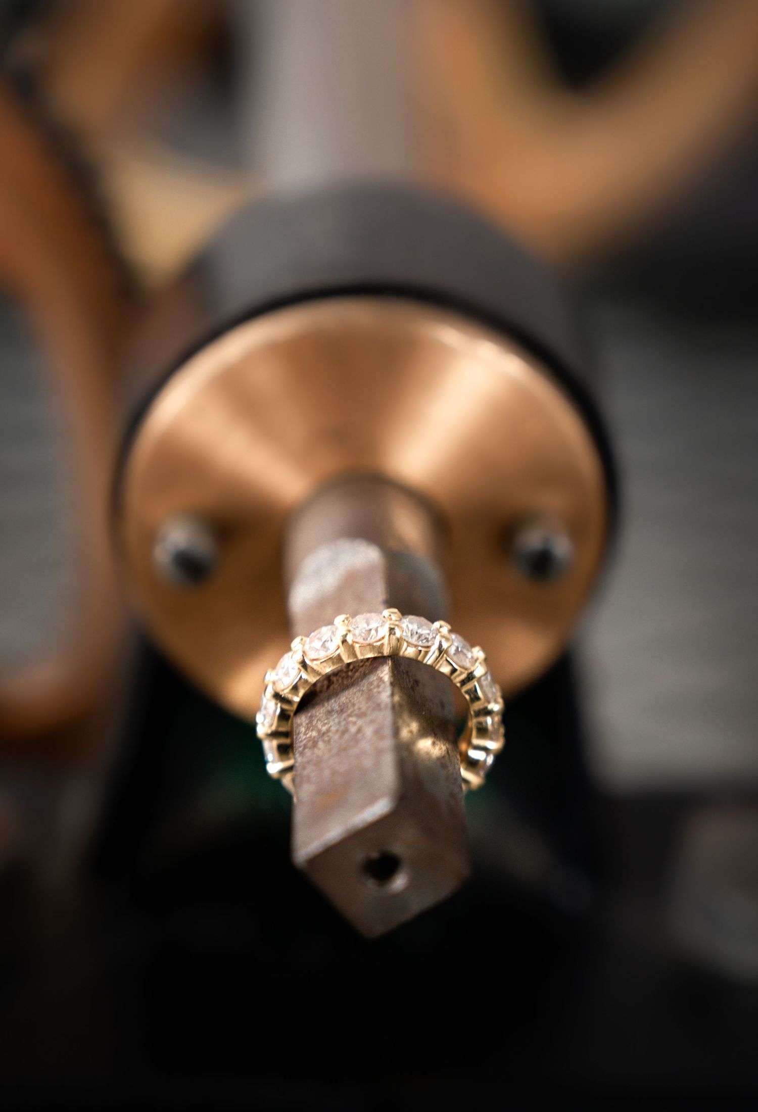 Close-up macro shots of a sparkling engagement ring with diamonds.