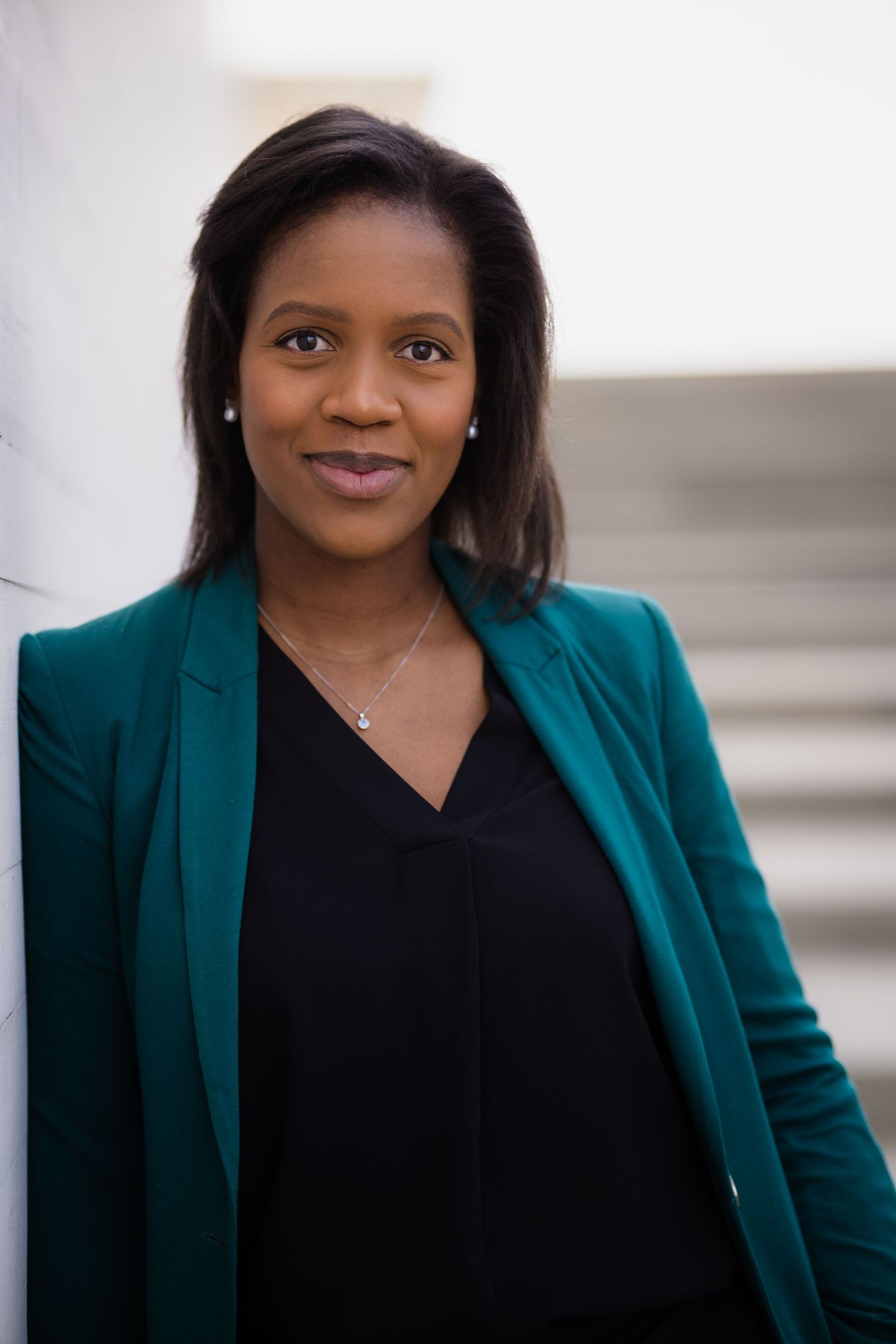 Business portrait series against light background showing confident poses.