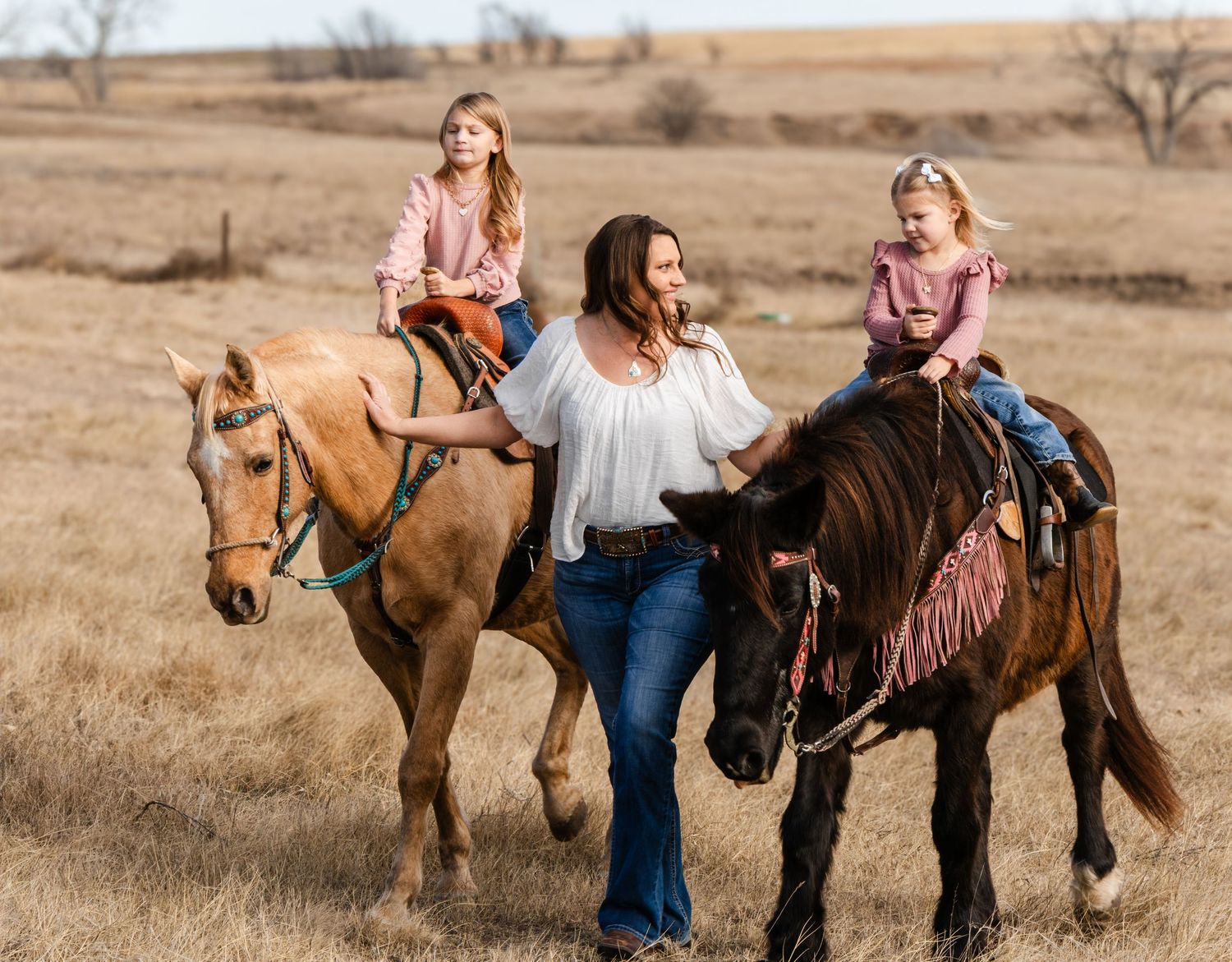 Mom and the girls with their horses.