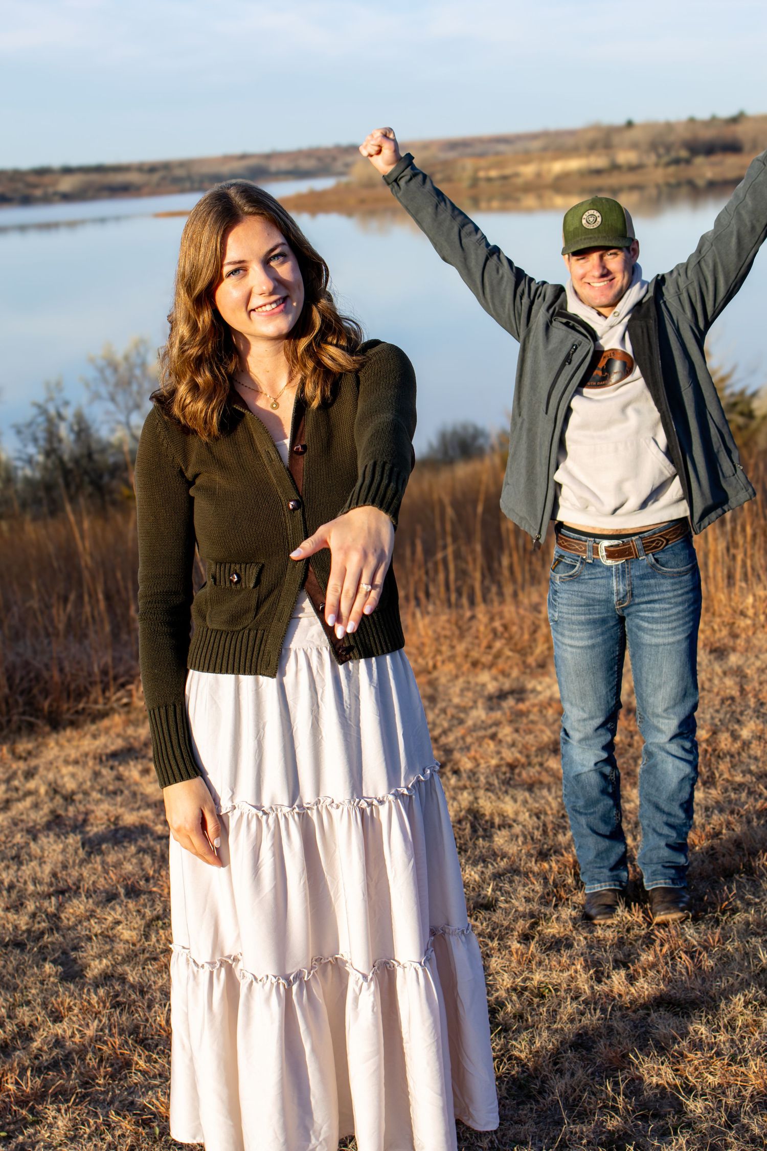 Engaged couple celebrating the moment during a beautiful Nebraska fall morning.