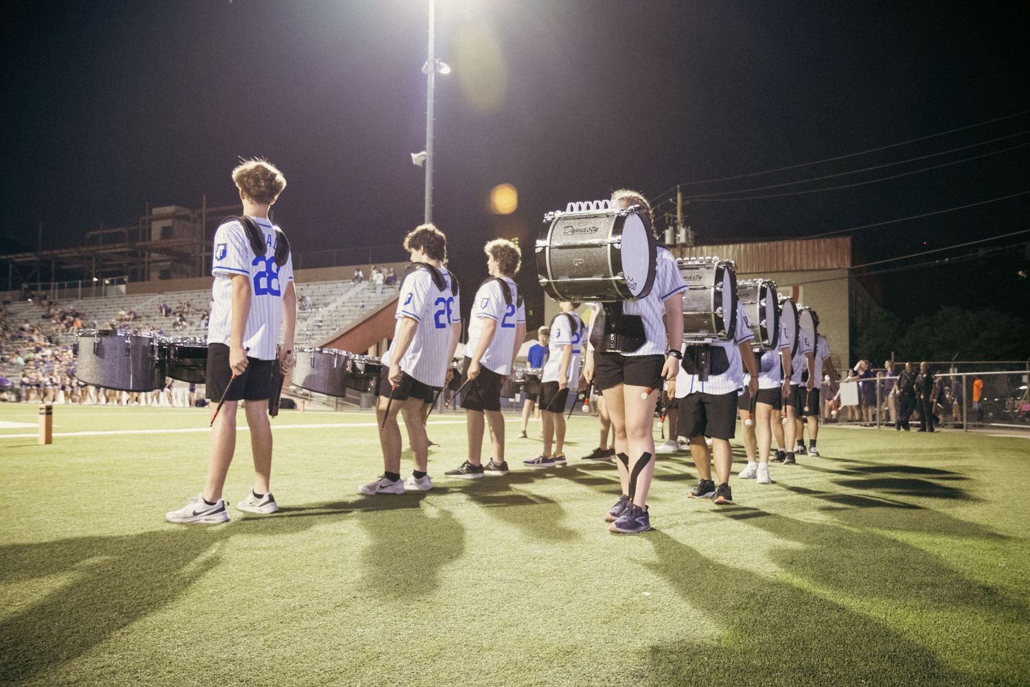 “Drumline warming up before a performance at a high school stadium in Austin, Texas.