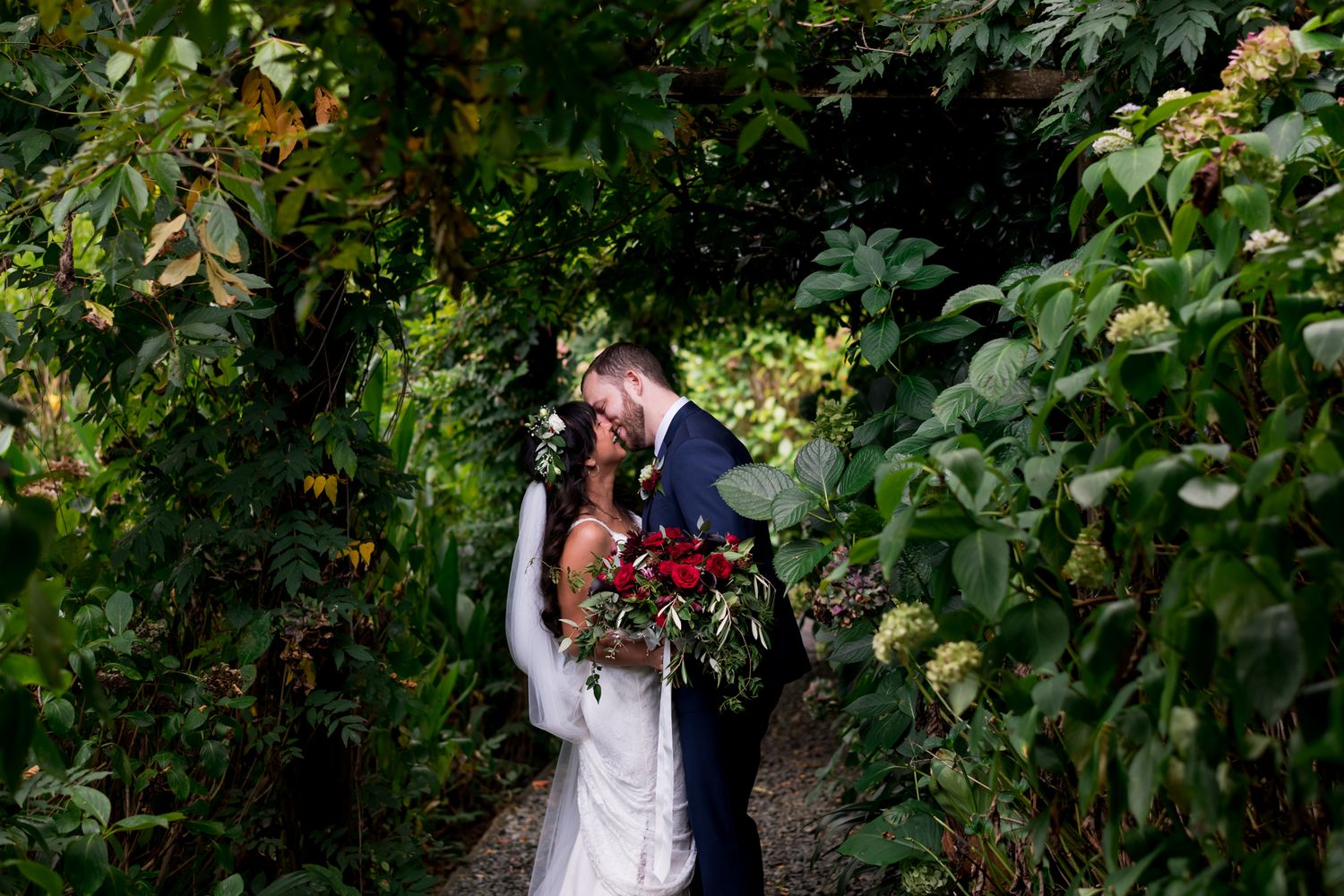 A bride and groom kiss