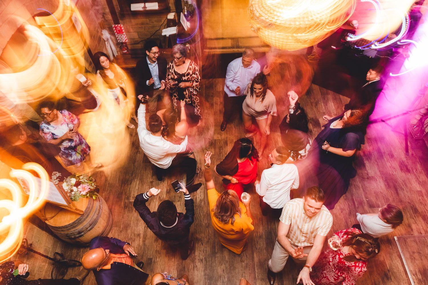 a party is in full spring and the flash brings lots of movement of the dance floor