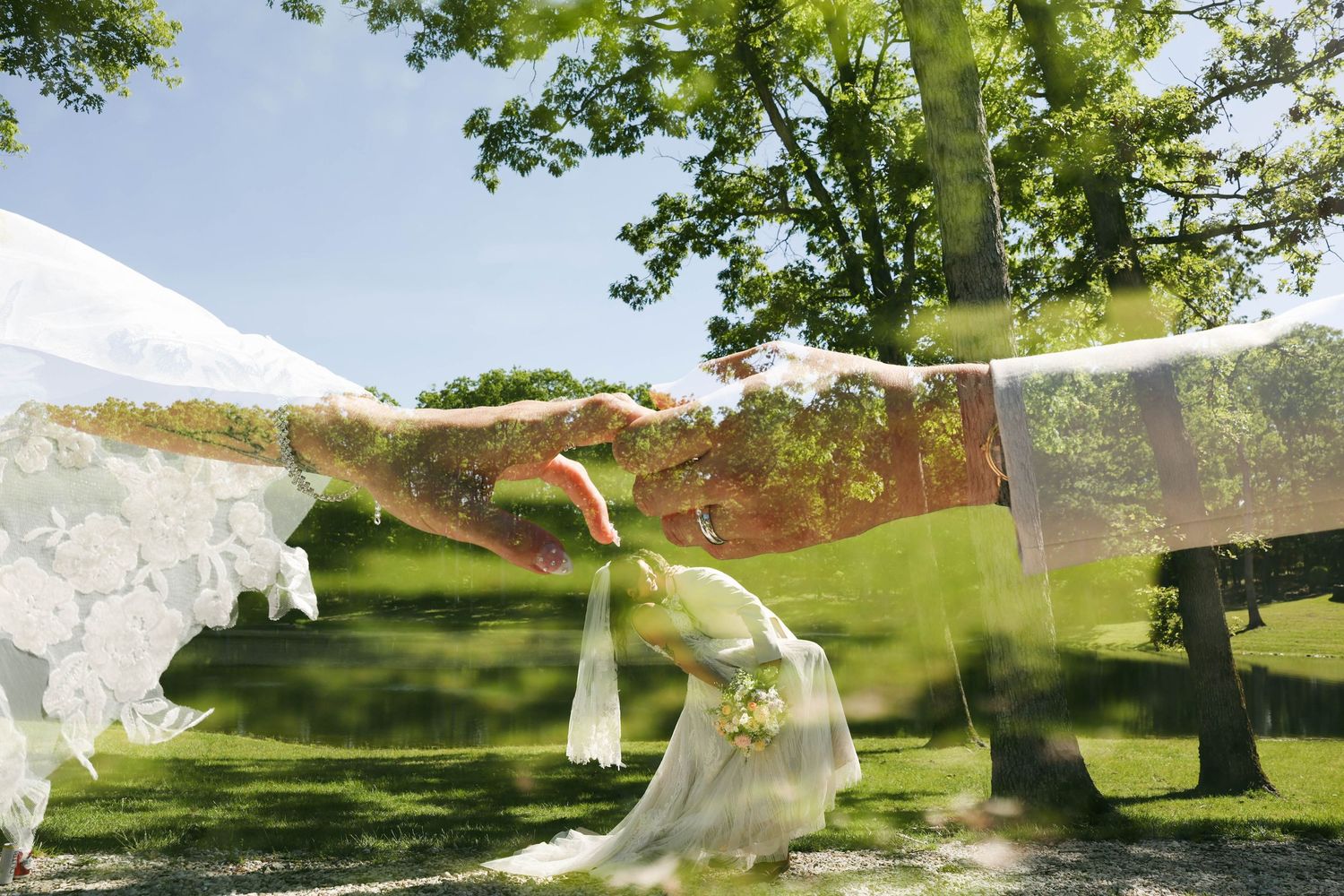 Bride in white dress reaches out gracefully outdoors, with a dreamy double exposure effect blending nature and elegance.