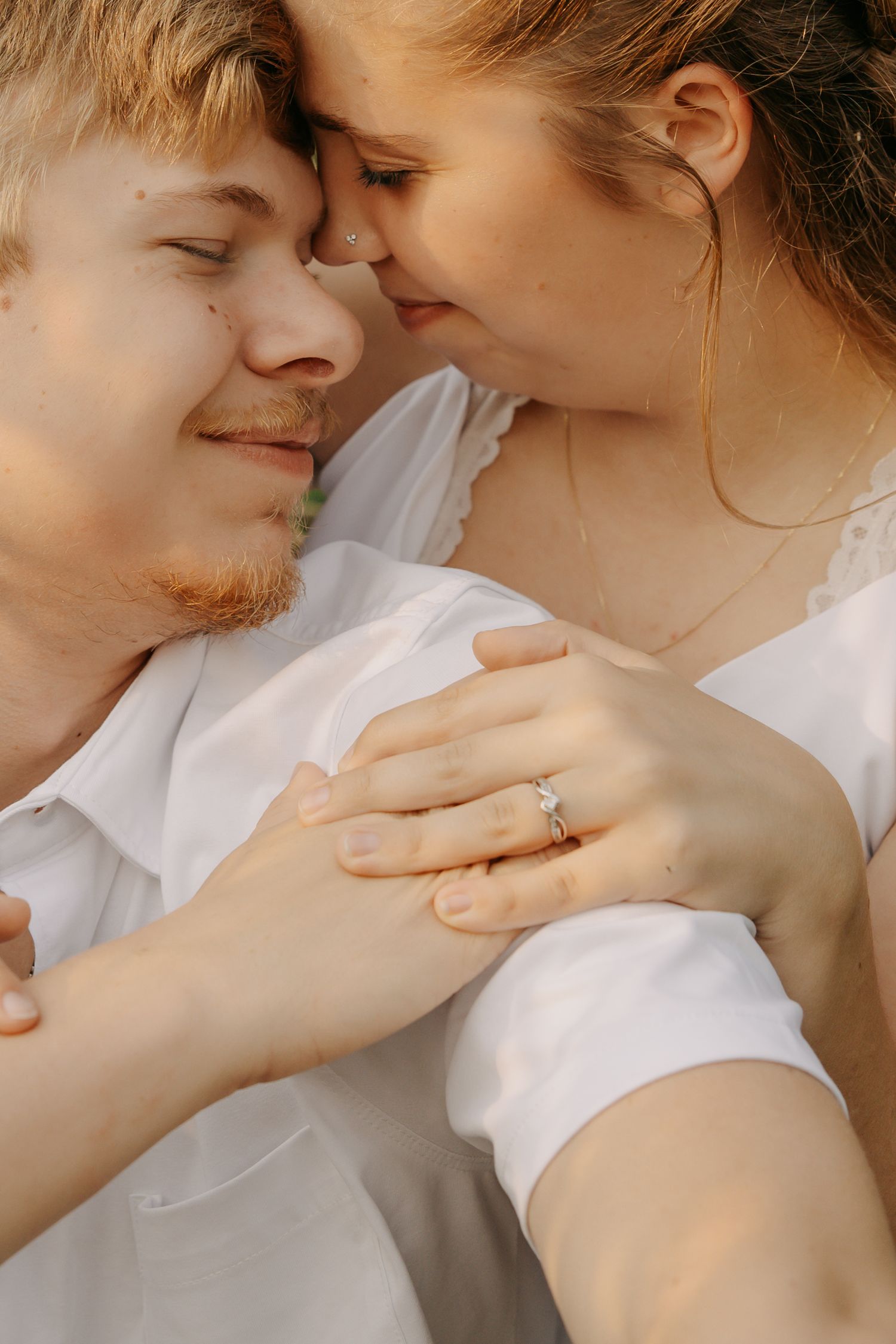 Close-up romantic portraits showing tender moments between a couple.