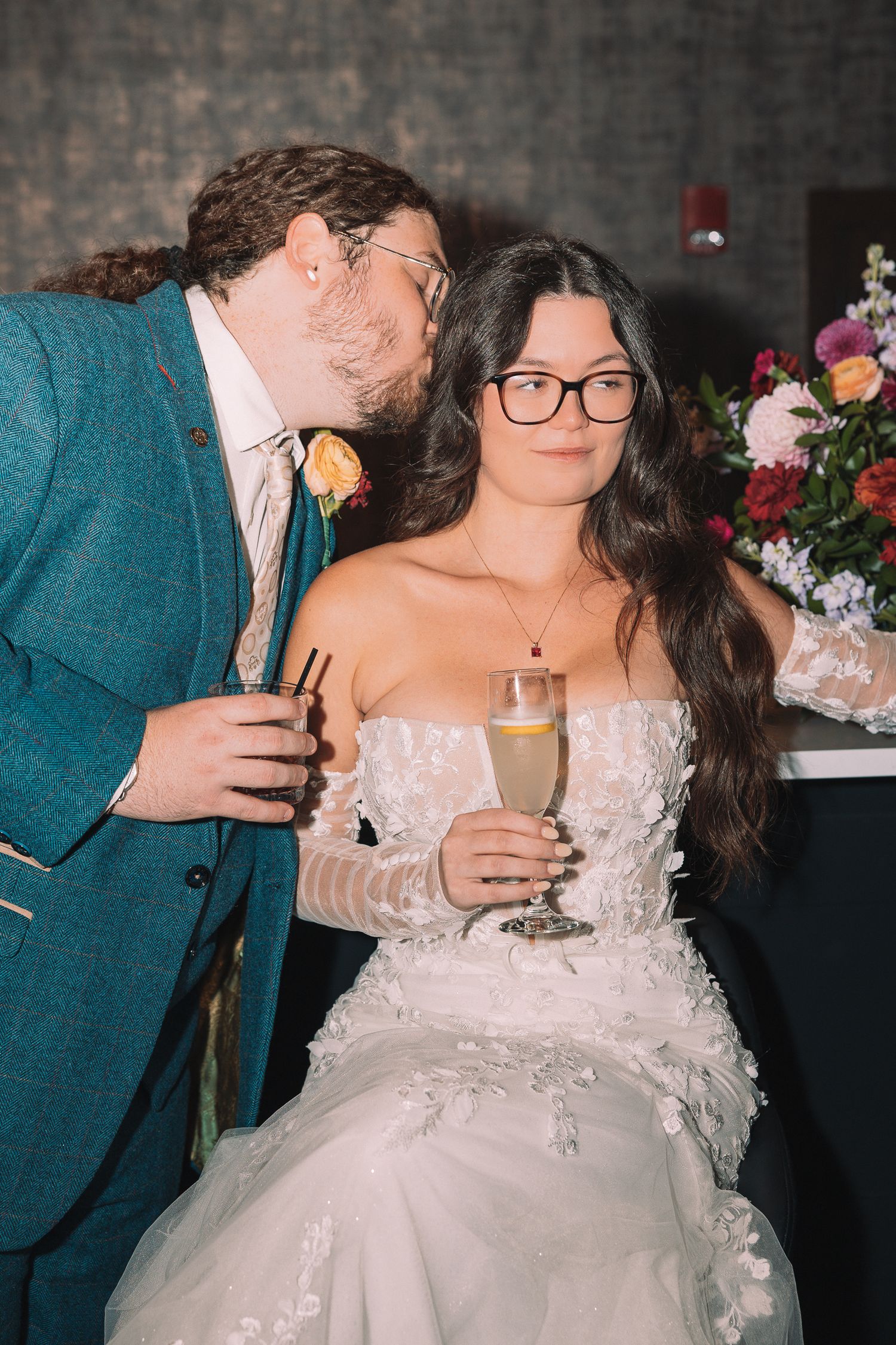 Wedding reception sequence showing couple in teal and white sharing drinks and intimate moments.