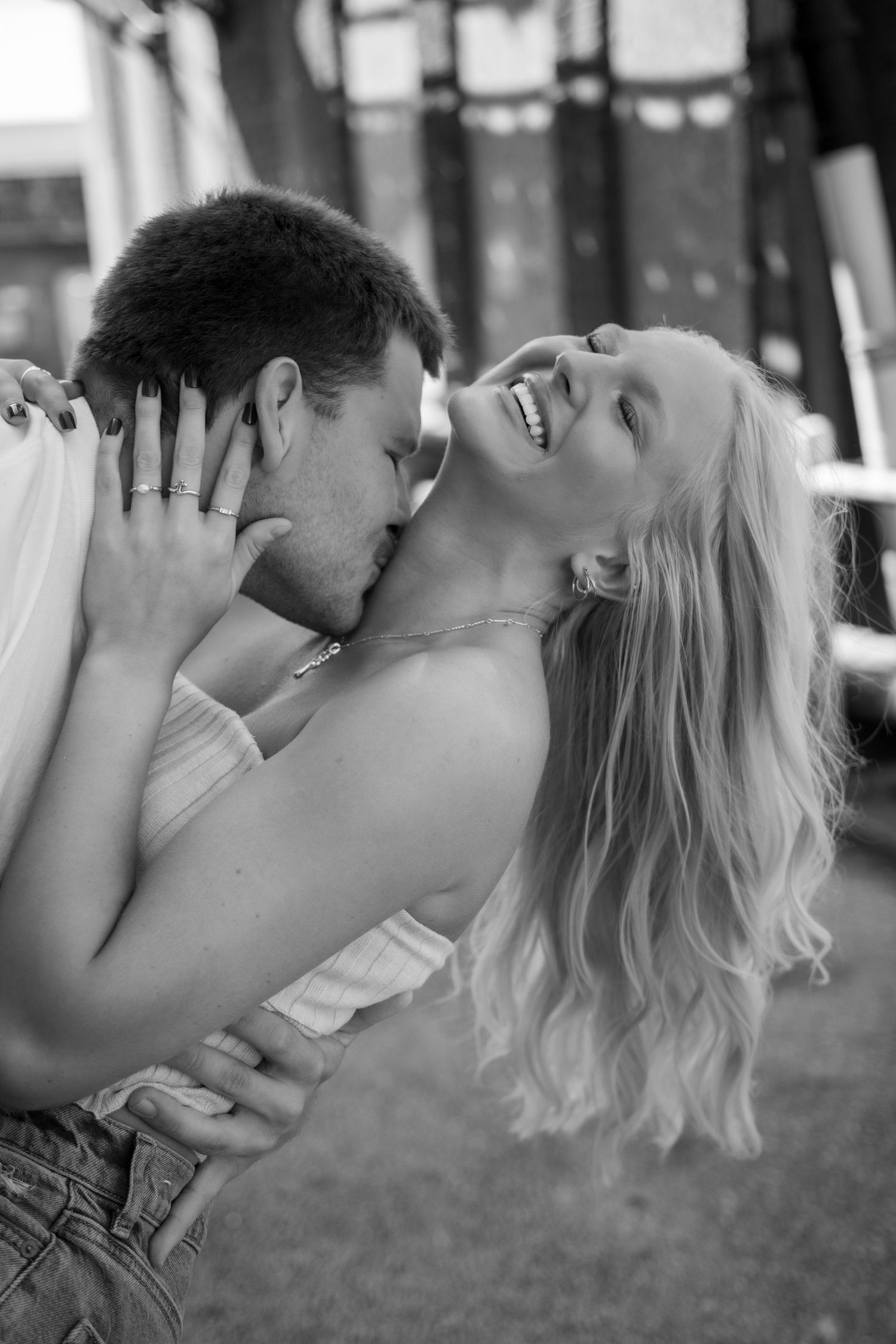 Black and white romantic photo sequence showing tender moments between a couple.