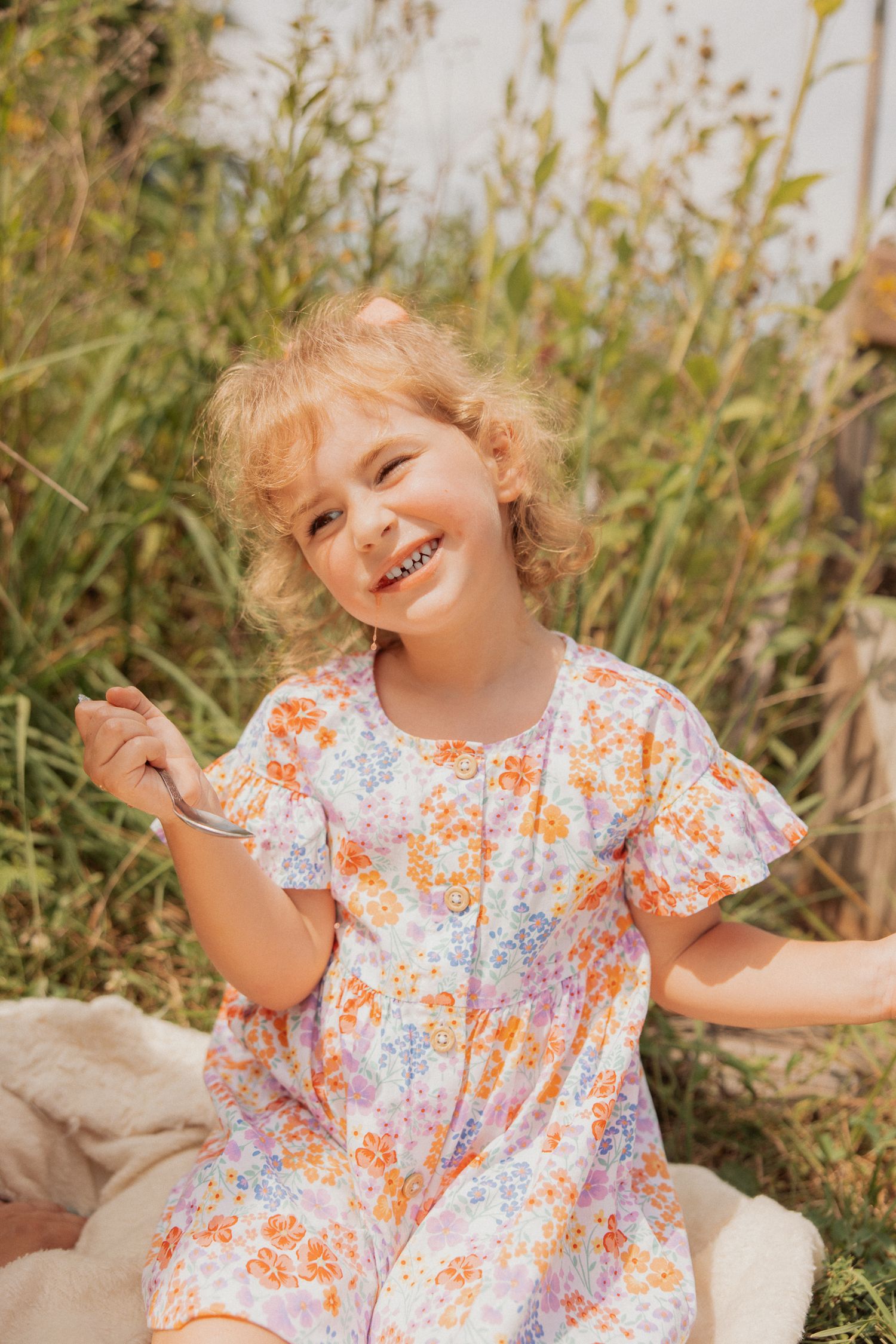 A joyful summer moment captured in a field of yellow wildflowers.