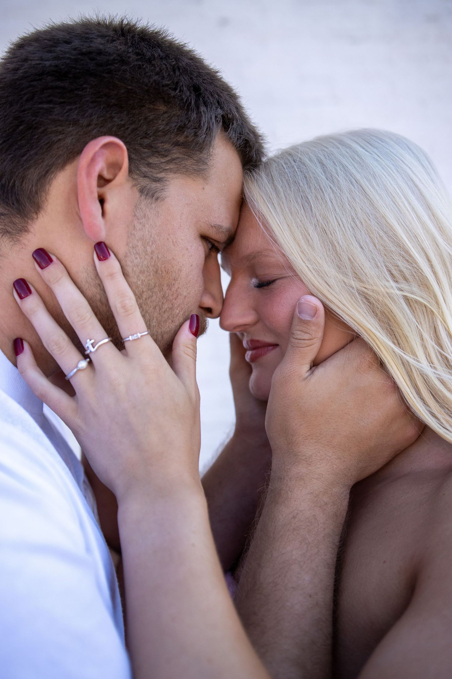 Intimate close-up portrait of couple sharing tender moment together.
