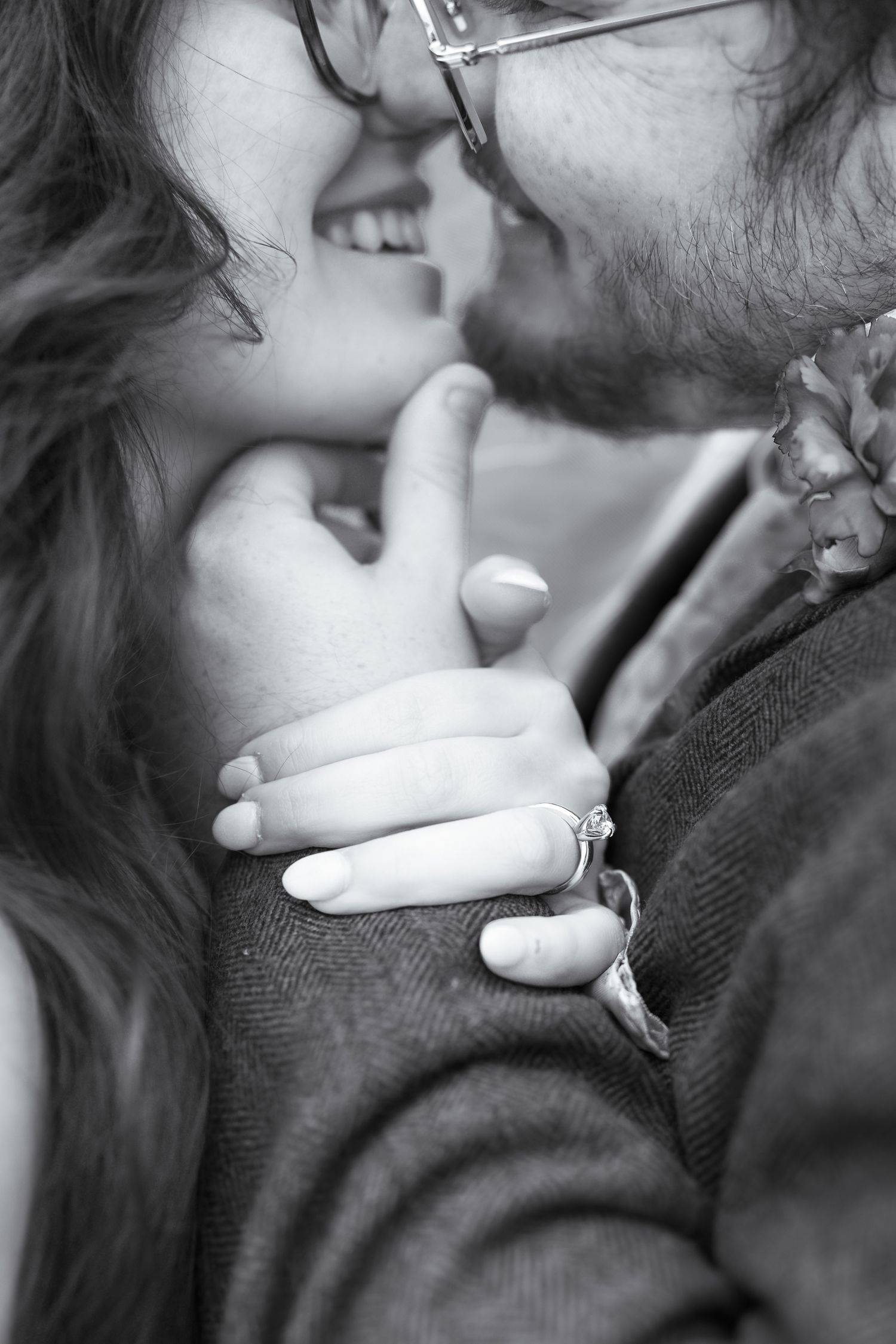 Series of intimate black and white close-up shots showing tender wedding day kisses.