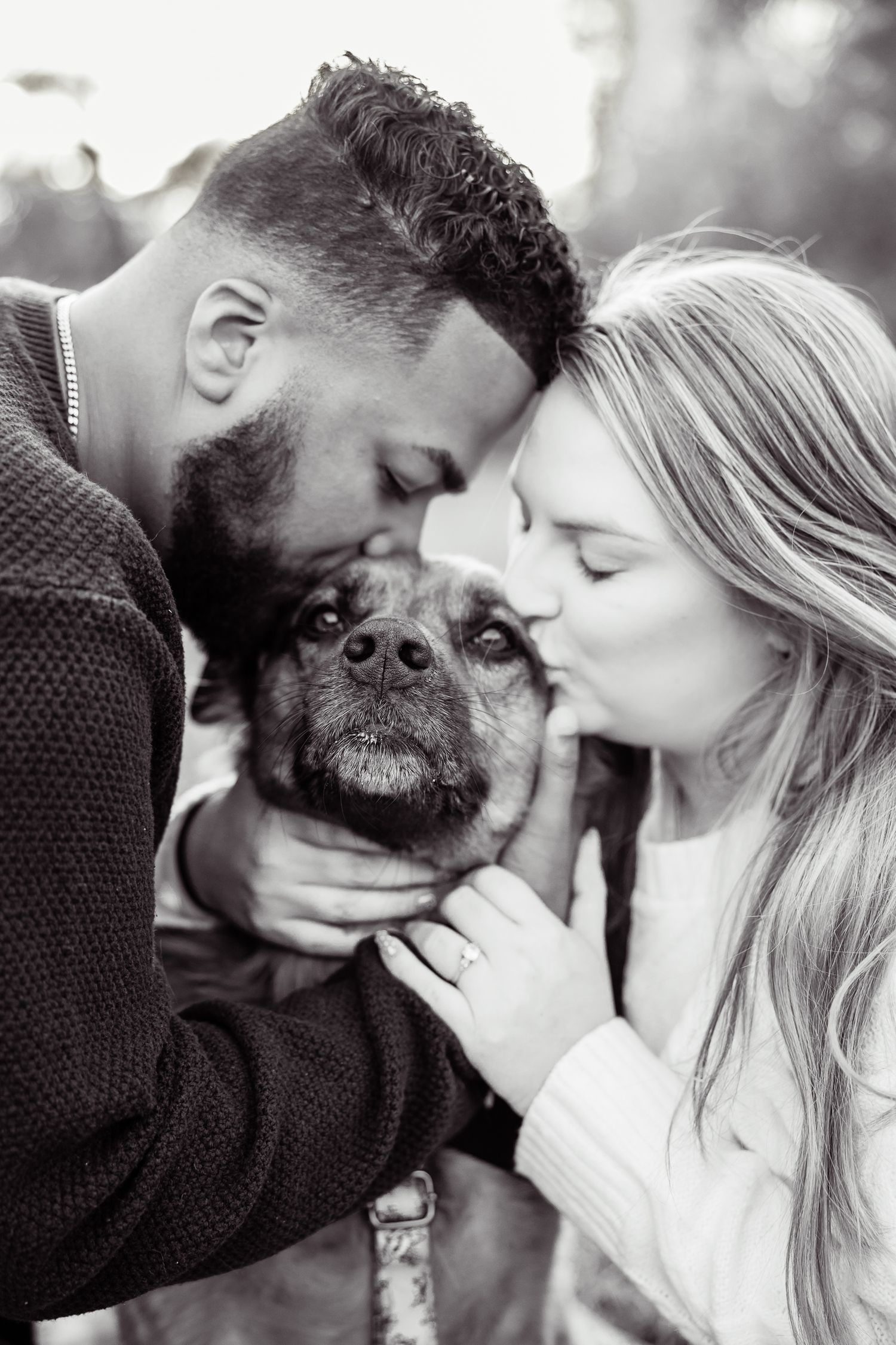 Sweet engagement photos with couple and their dog sharing tender moments together.