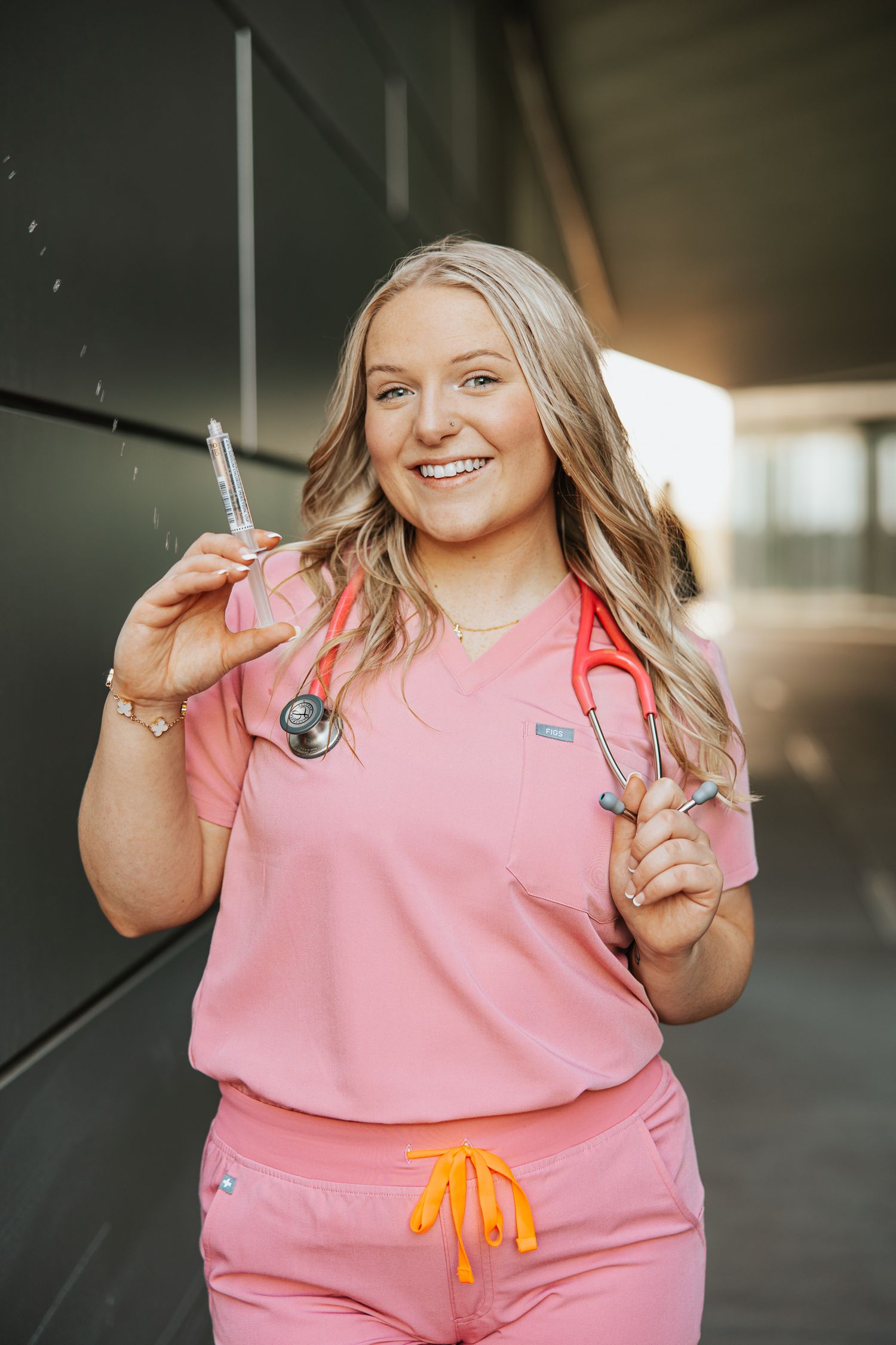 Person wearing pink athletic wear poses playfully in a casual photo series.