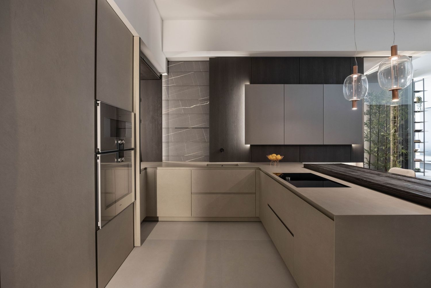 Streamlined kitchen interior with handle-less cabinets and sophisticated lighting design.