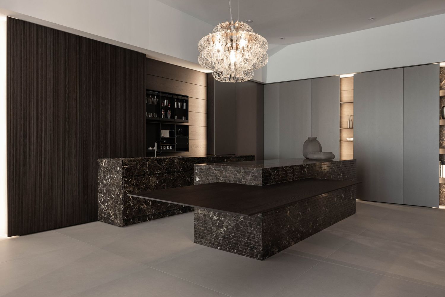 Modern living space with marble accents and built-in storage in dark tones.