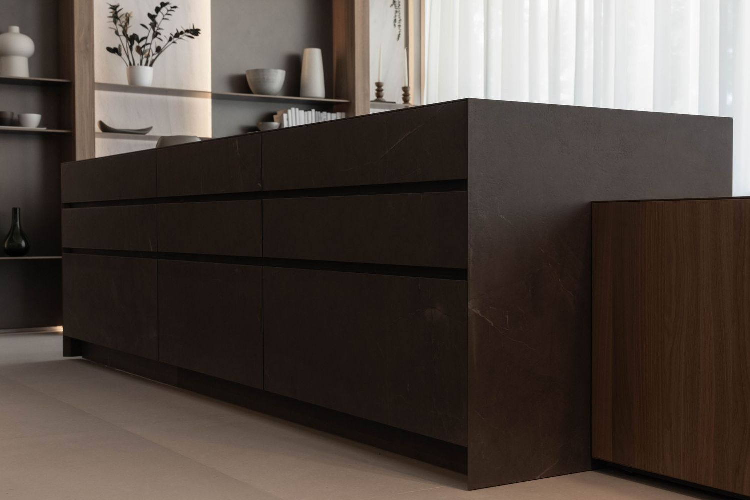 Contemporary dark wood cabinetry extending along minimalist interior space.
