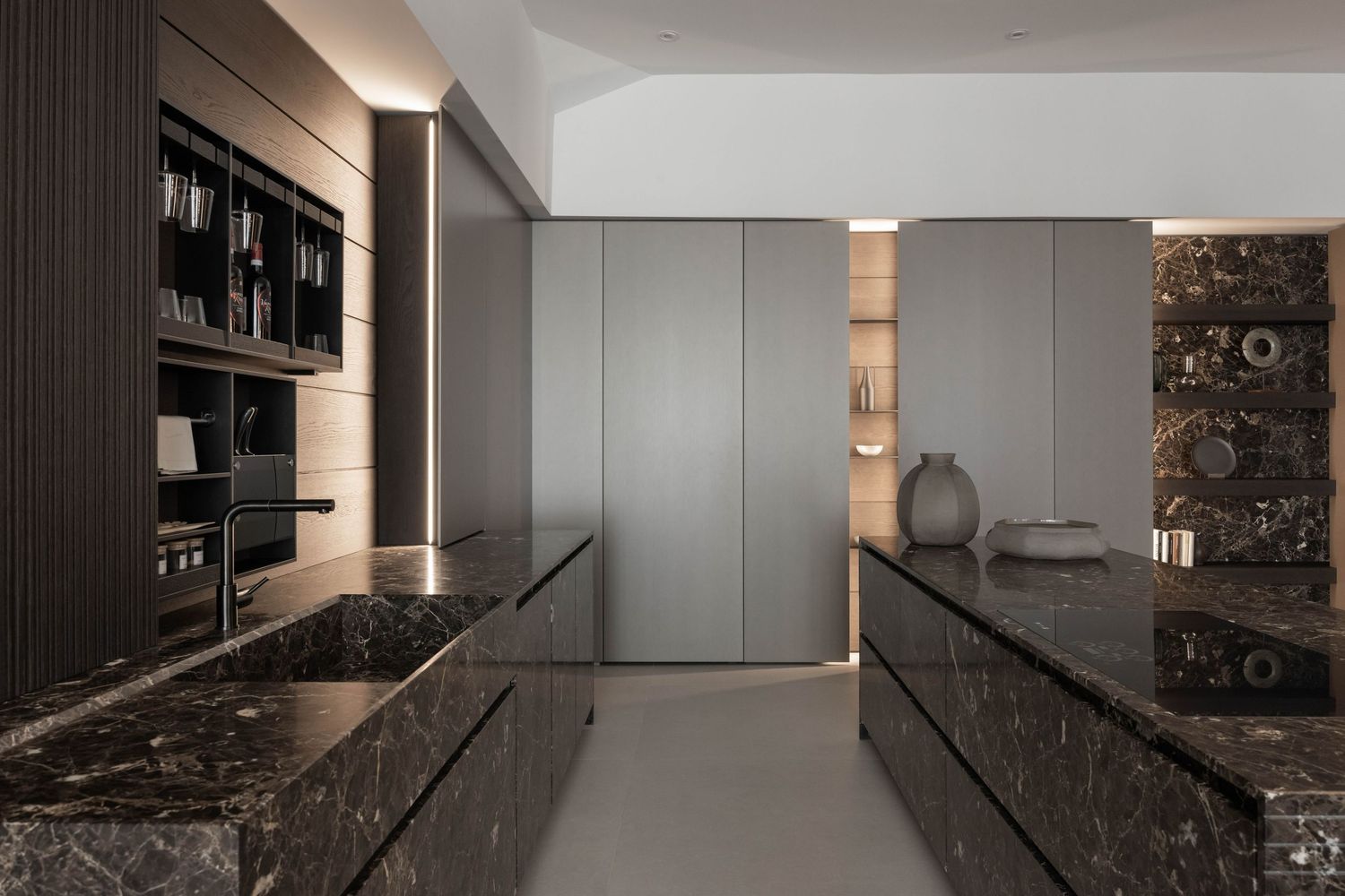 Contemporary kitchen featuring dramatic dark marble backsplash and integrated appliances.