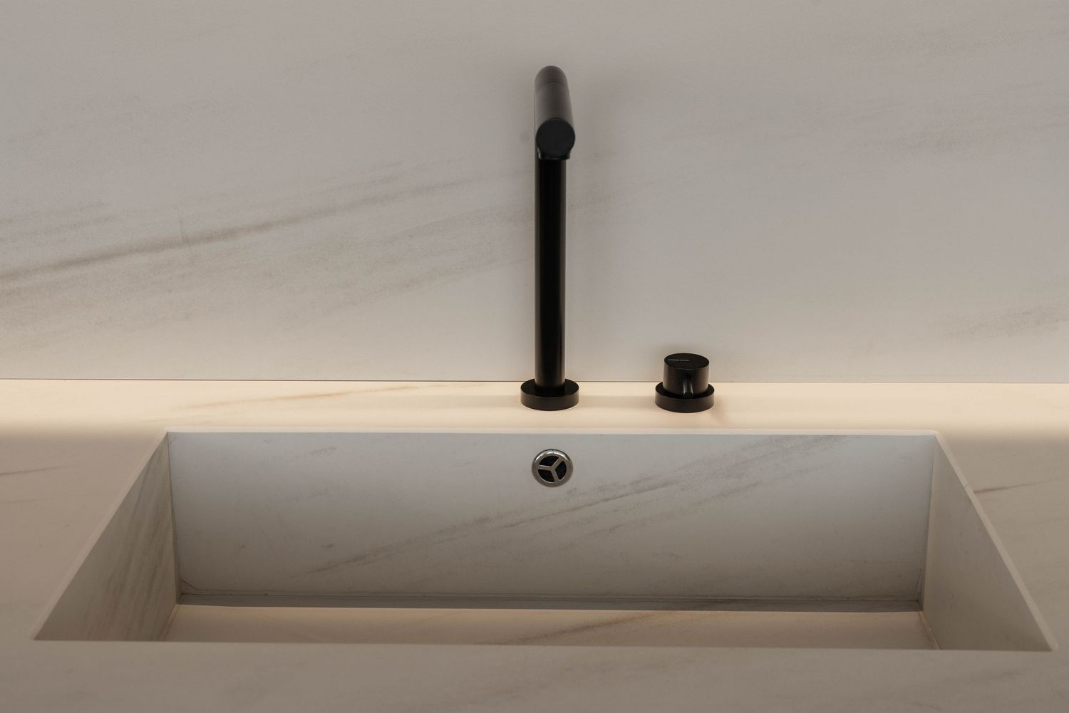 Sleek ceiling detail with recessed lighting and minimal industrial fixtures in modern interior.