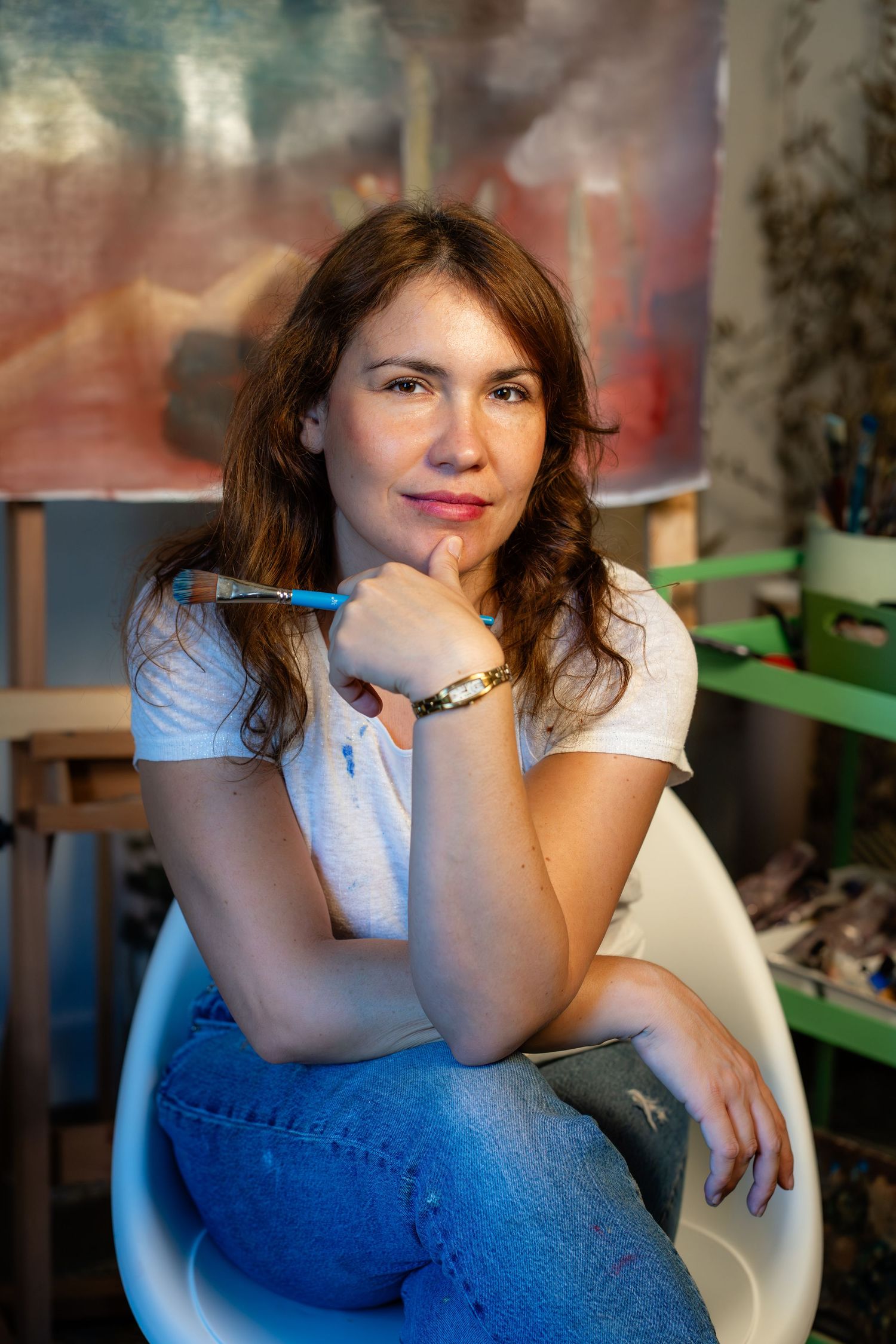 Casual portrait series against moody blue background showing contemplative poses.