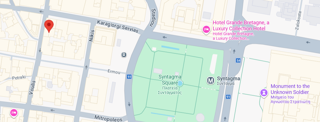 A map view showing streets and intersections with red location markers and route lines in an urban area.