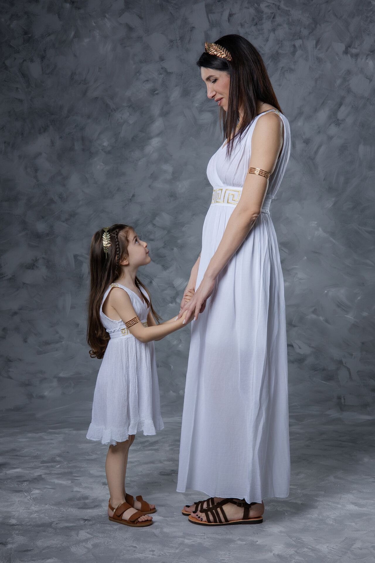Heartwarming moment in Athens: Get photographed as an Ancient Greek mother and child for a timeless family memory.