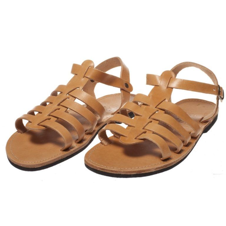 Tan leather gladiator sandals with strappy woven design and ankle buckle closure on white background.