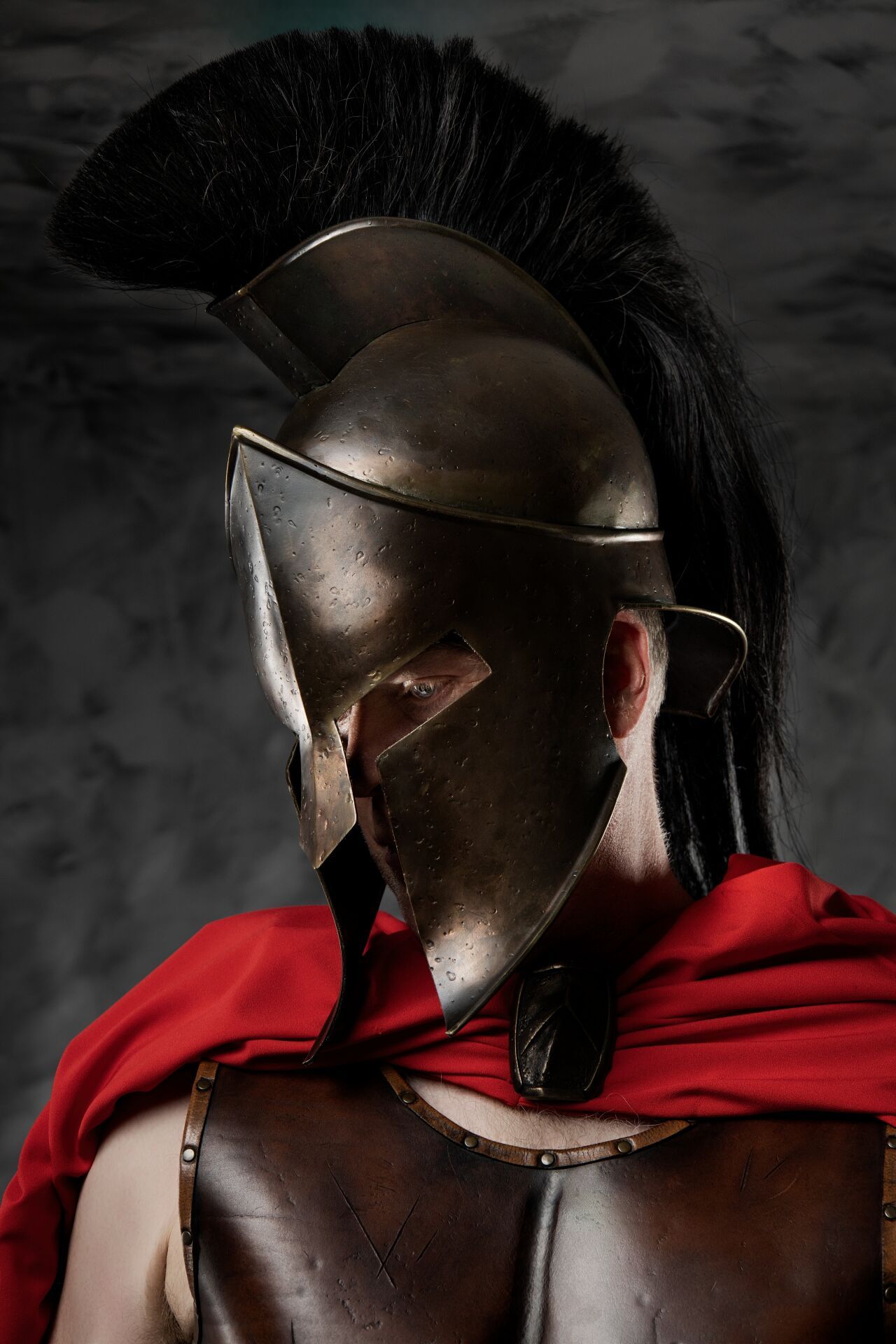 Experience a cinematic close-up Spartan warrior portrait in Athens with an authentic Ancient Greek helmet at GreekClick.