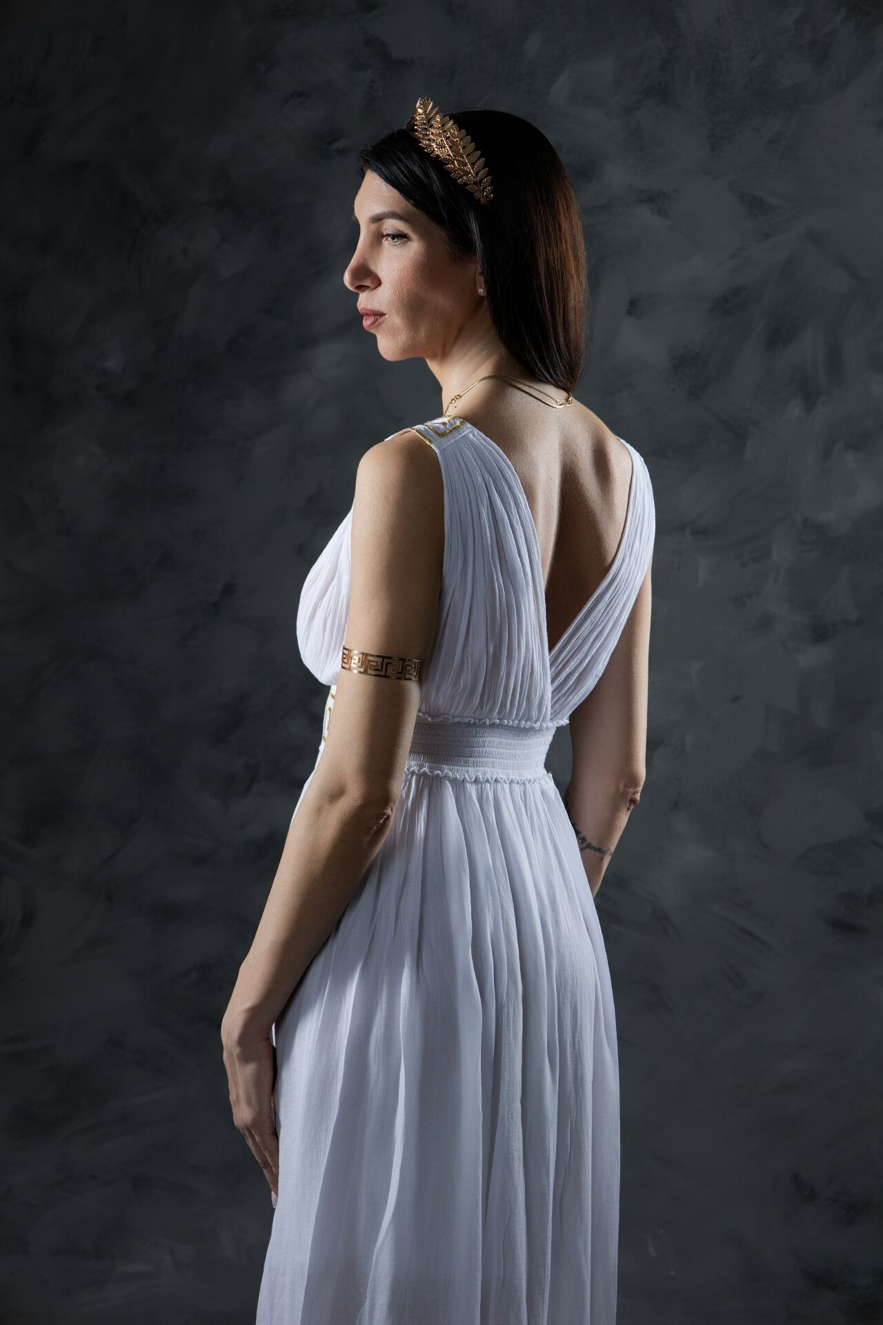 Capture your inner Hera: Professional studio portrait of a mother in a high-quality Ancient Greek costume.