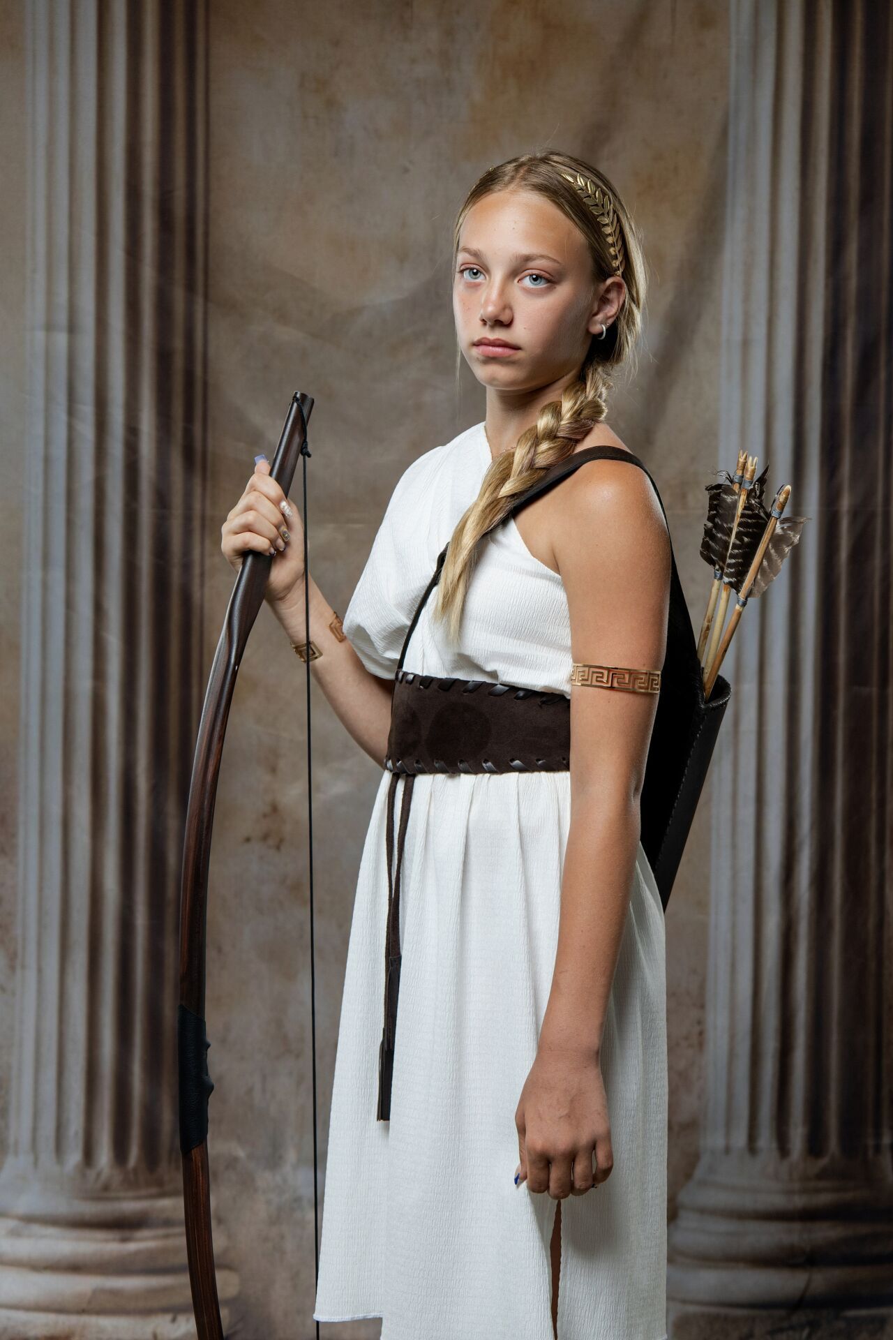Artemis Ancient Greek costume photoshoot in Athens with bow styling, goddess details and GreekClick portraits.