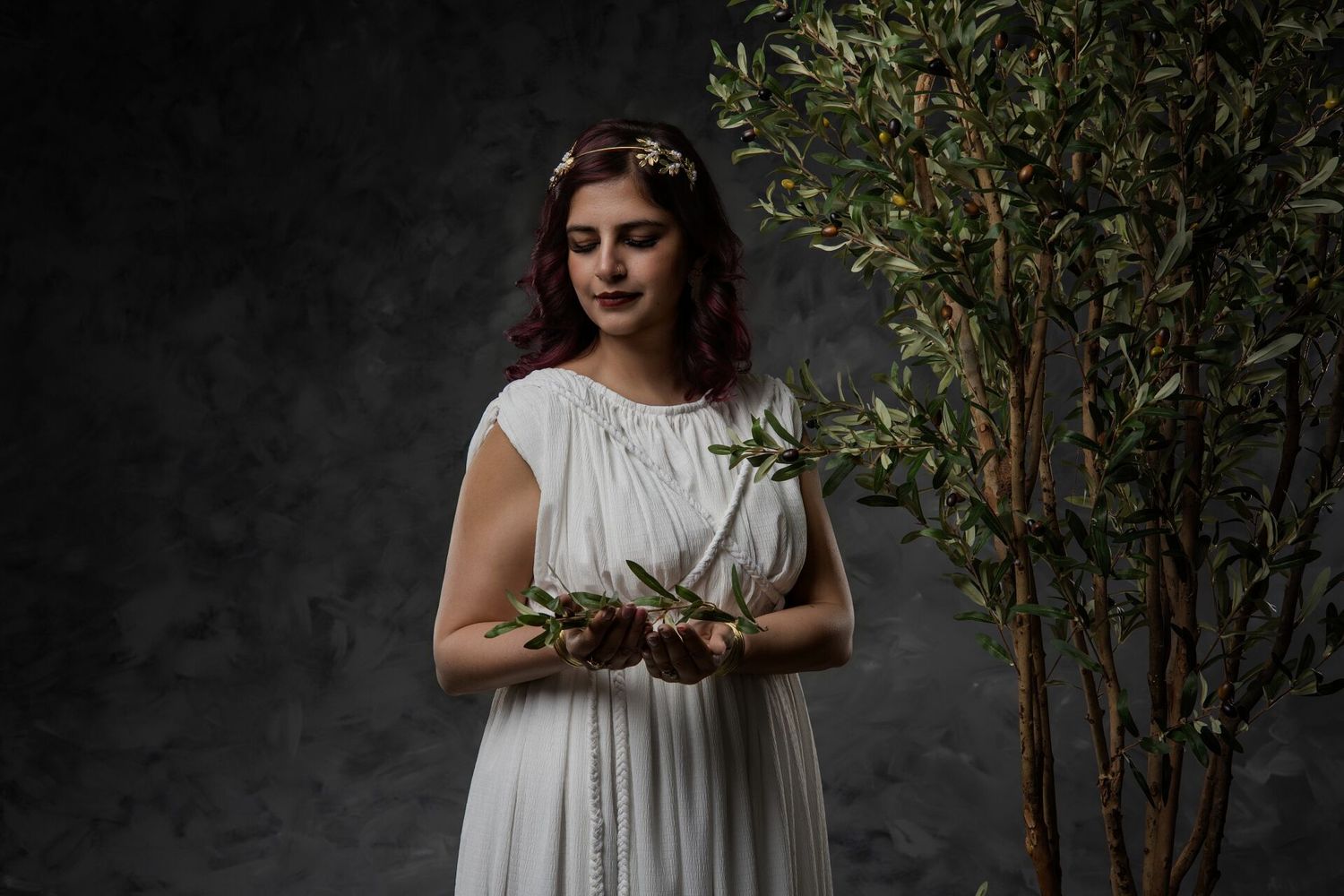 High Priestess Ancient Greece photo experience in Athens with mystical goddess styling, olive branch, dramatic makeup and GreekClick portrai