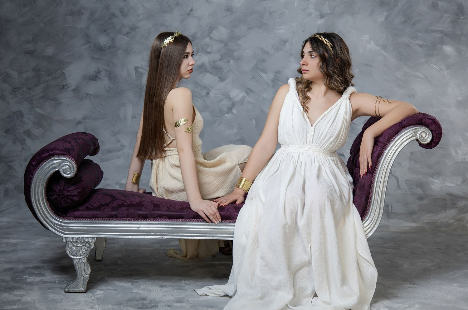 Beautiful teenage girl posing in authentic ancient Greek costume for a professional studio photoshoot in Athens.