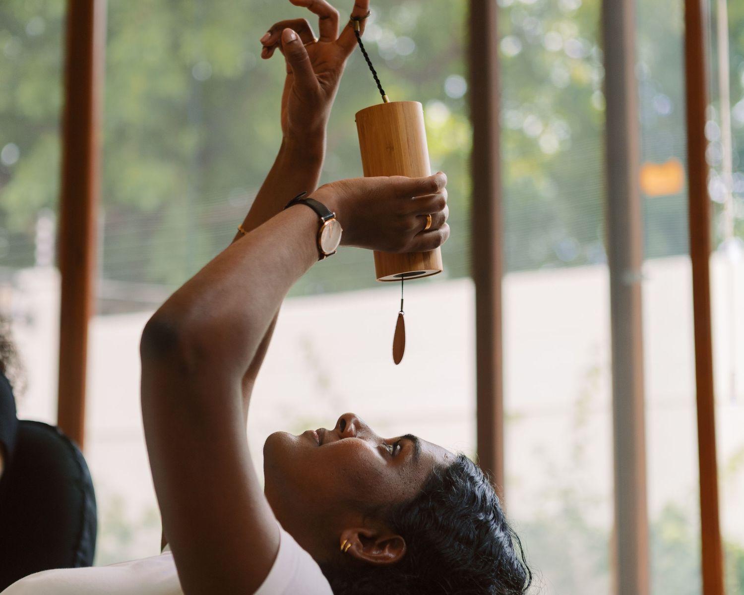 Candid moment of a sound ceremony, sensory branding photography for wellness and hospitality clients by Naezi Eyes.